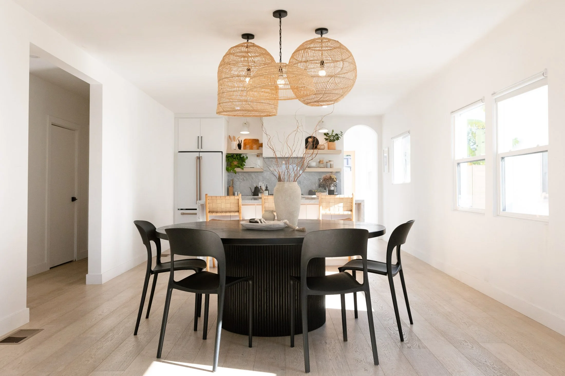 Black round fluted pedestal dining table