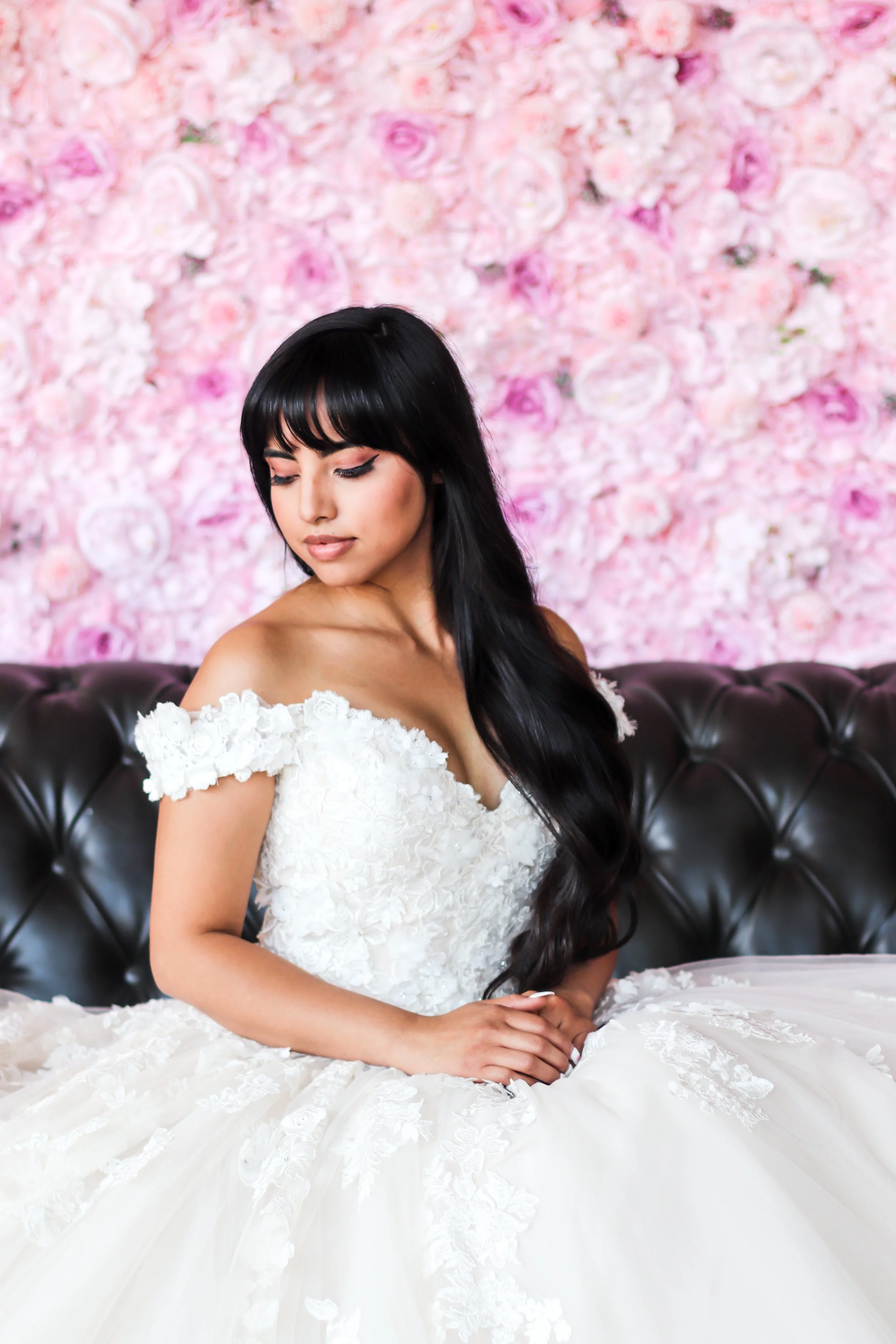 Bride and pink flower wall rental Denver
