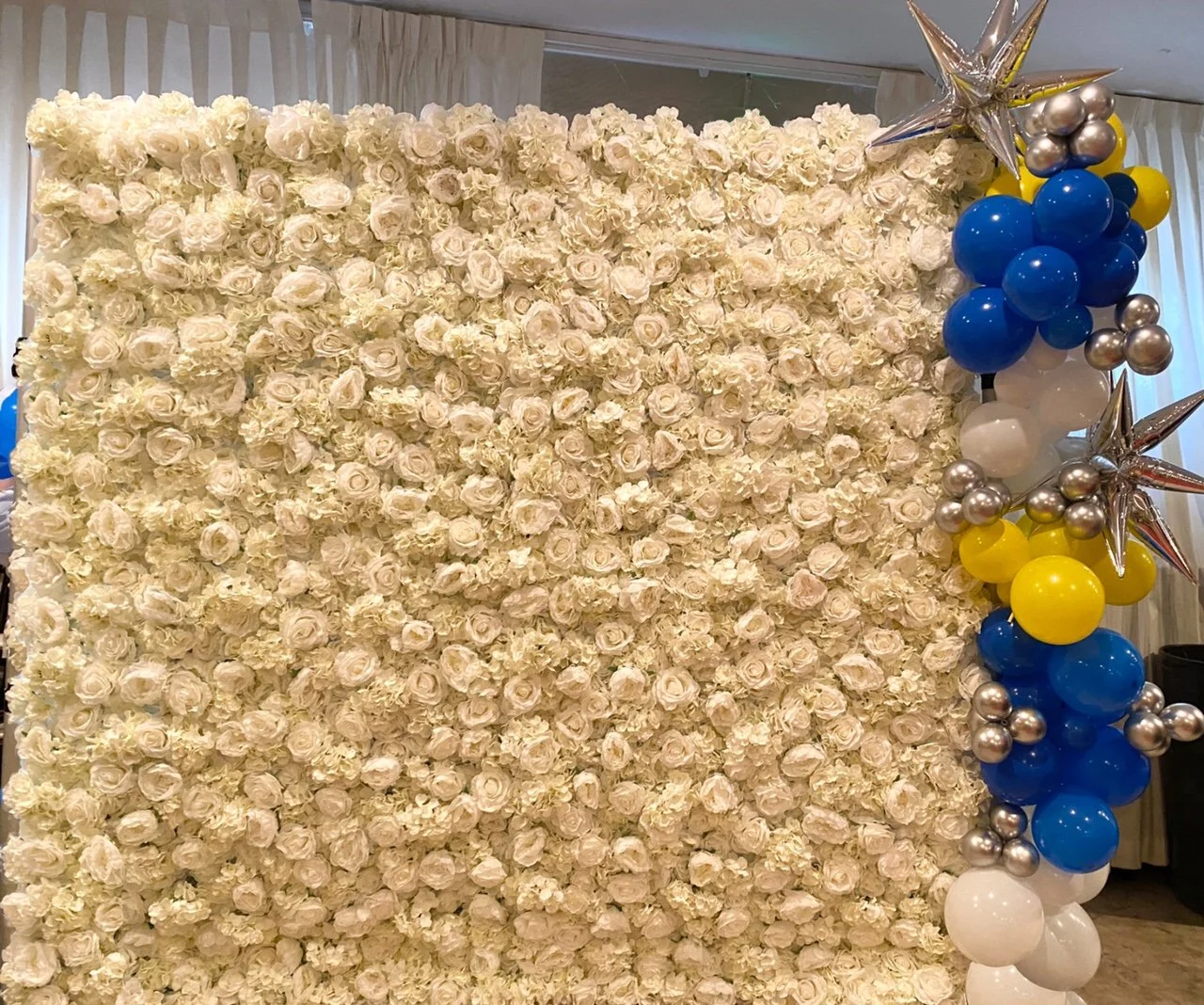 white flower wall fundraiser