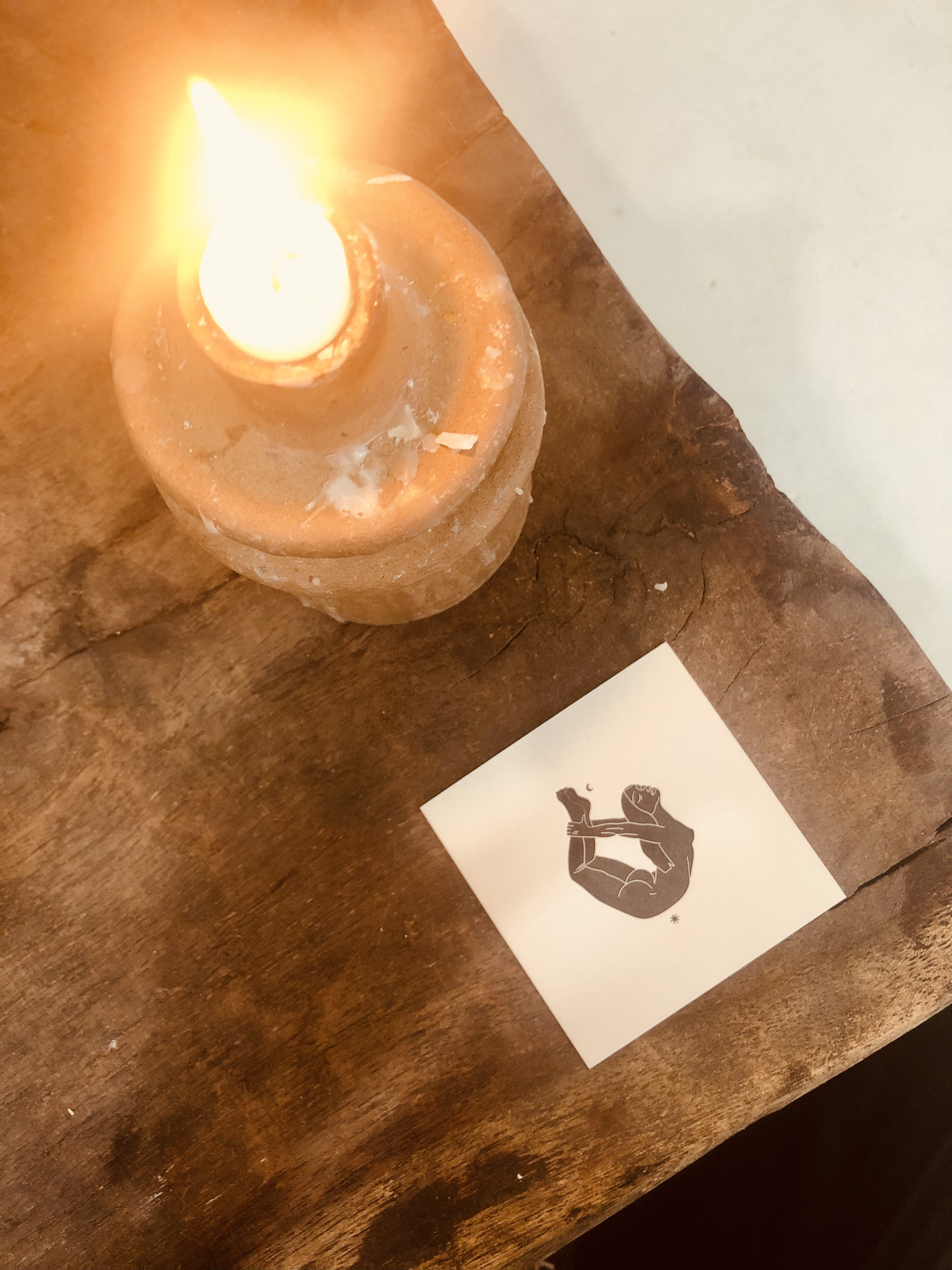 CASHMERR CACTUS LOGO CARD AND CANDLE ON TABLE.png