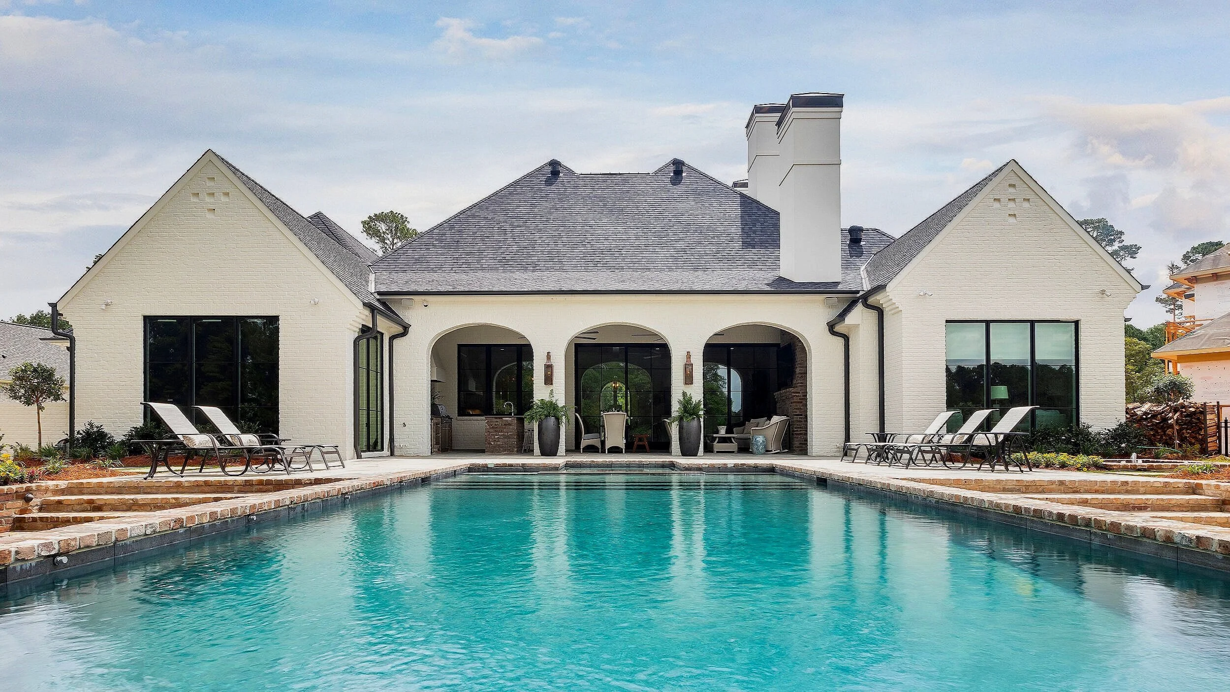 Beautiful home built by Wesley Thomas Construction.  Rectangular pool and spa designed and constructed by Waterscapes of Shreveport, Louisiana on Long Lake.