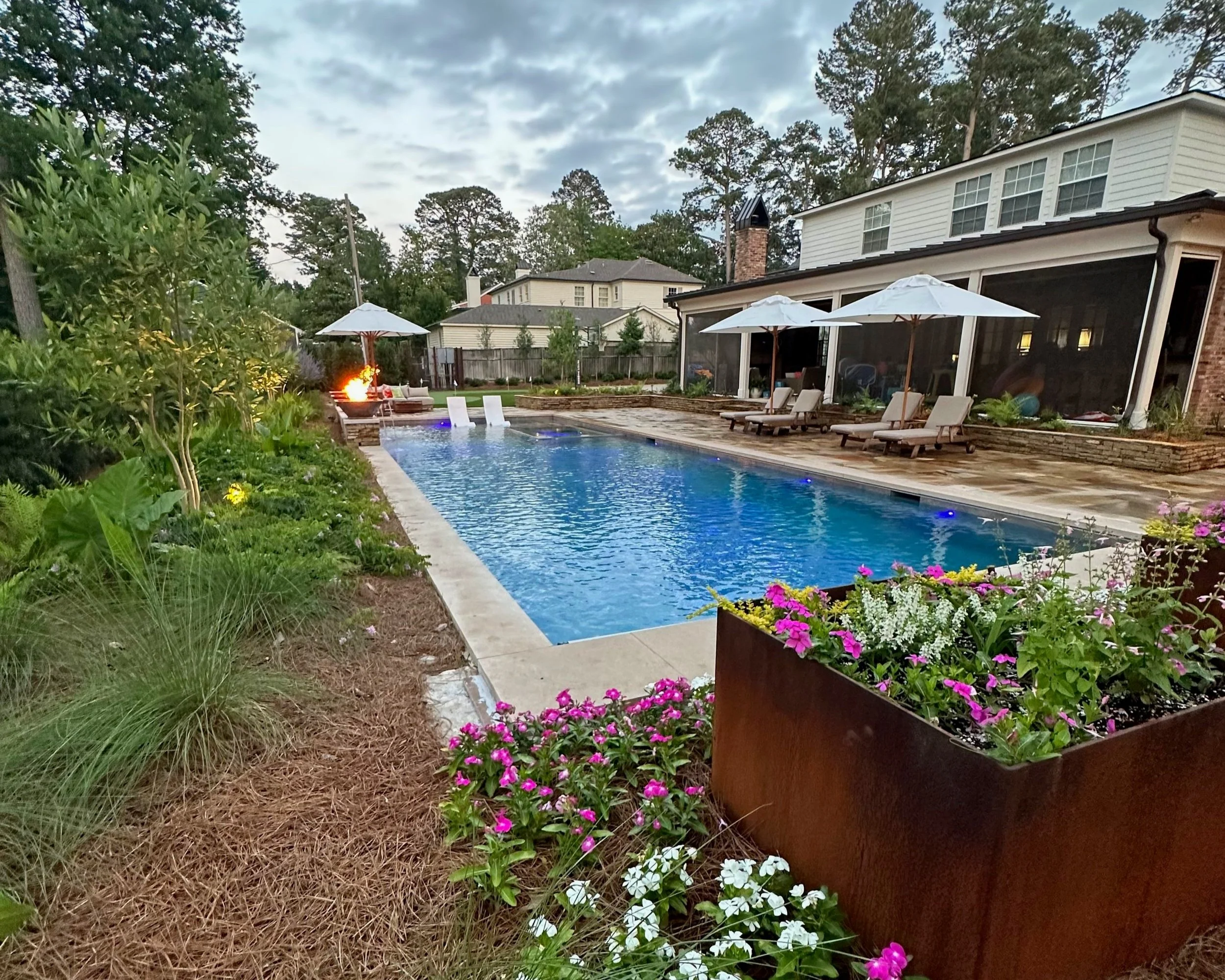 Custom rectangular shaped swimming pool, spa, decking, water and fire features designed, engineered and built by Waterscapes NWLA.