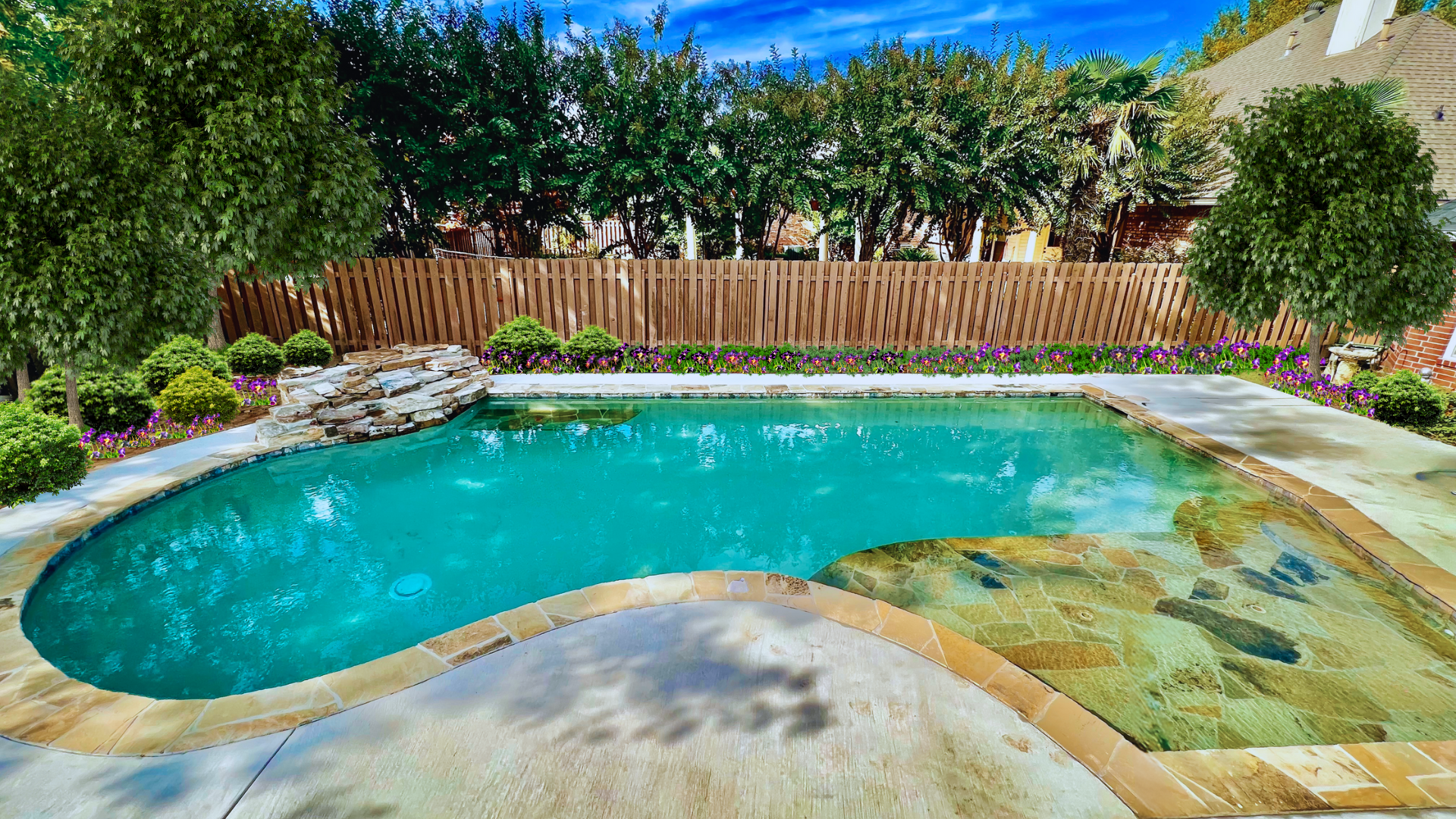 Geometric angles and curves are the features of the swimming pool design by Waterscapes of Shreveport Louisiana.  The pool also features a natural fieldstone waterfall which adds an ambient water sounds for those lounging around the swimming pool and