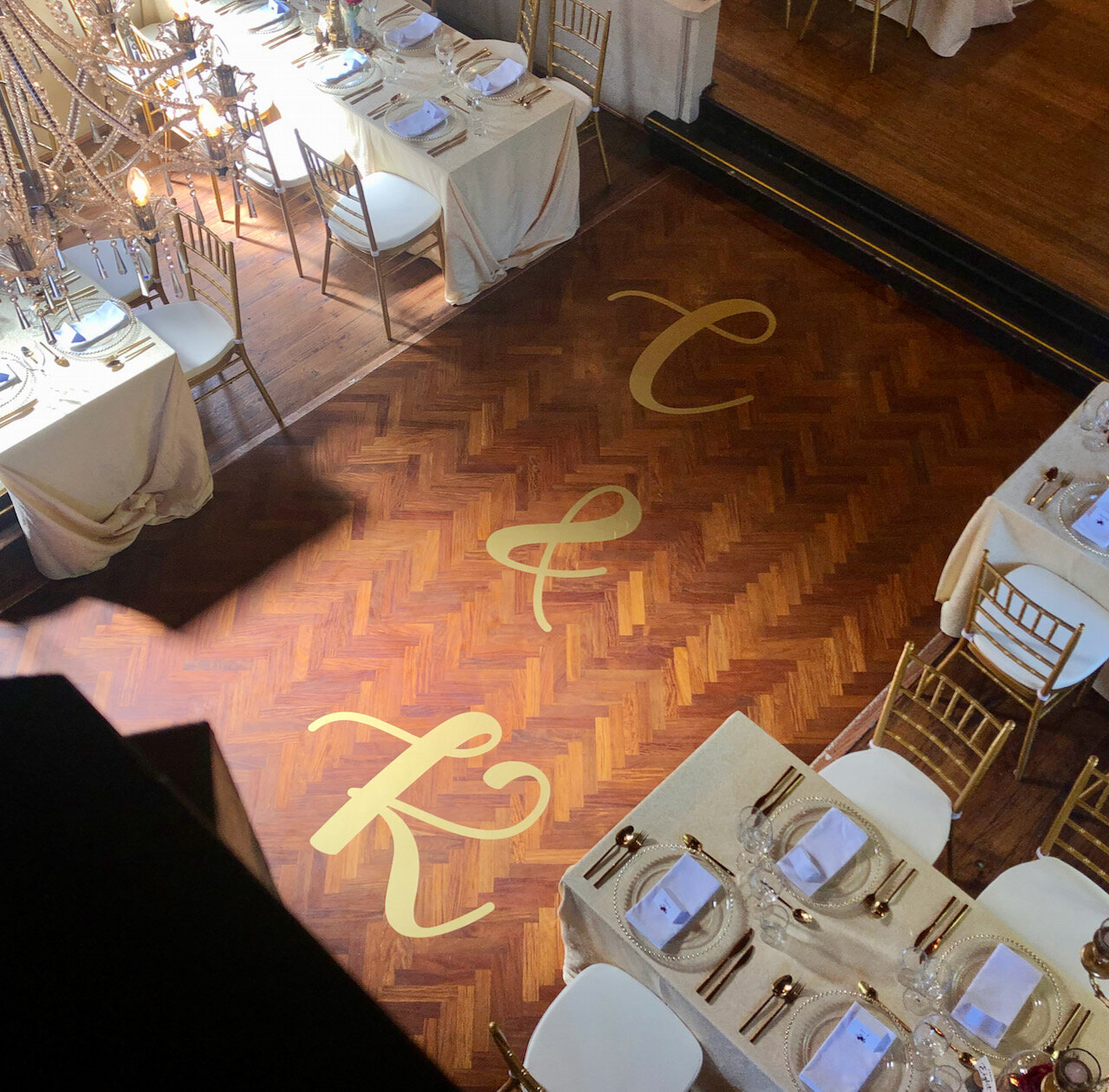 Dance floor decal gold vinyl on timber floor.jpeg