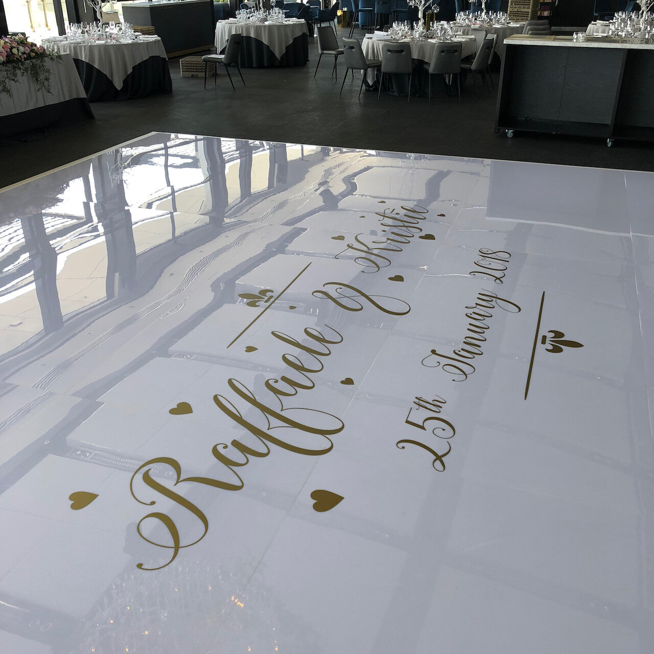 Dance floor decal gold vinyl on white acrylic.jpeg