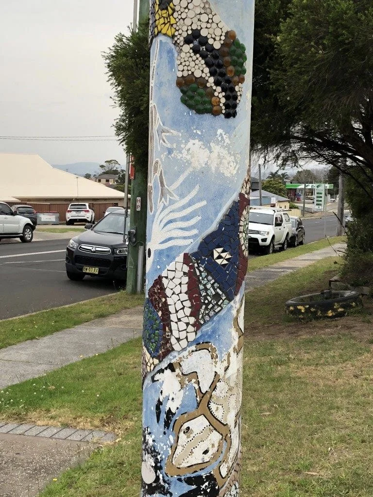 totem poles to welcome you to our community project.jpeg
