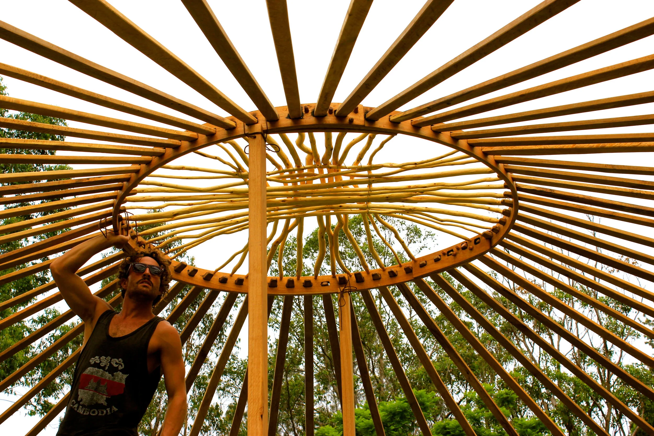 5 OCP Urban Grown building a Yurt frame.JPG