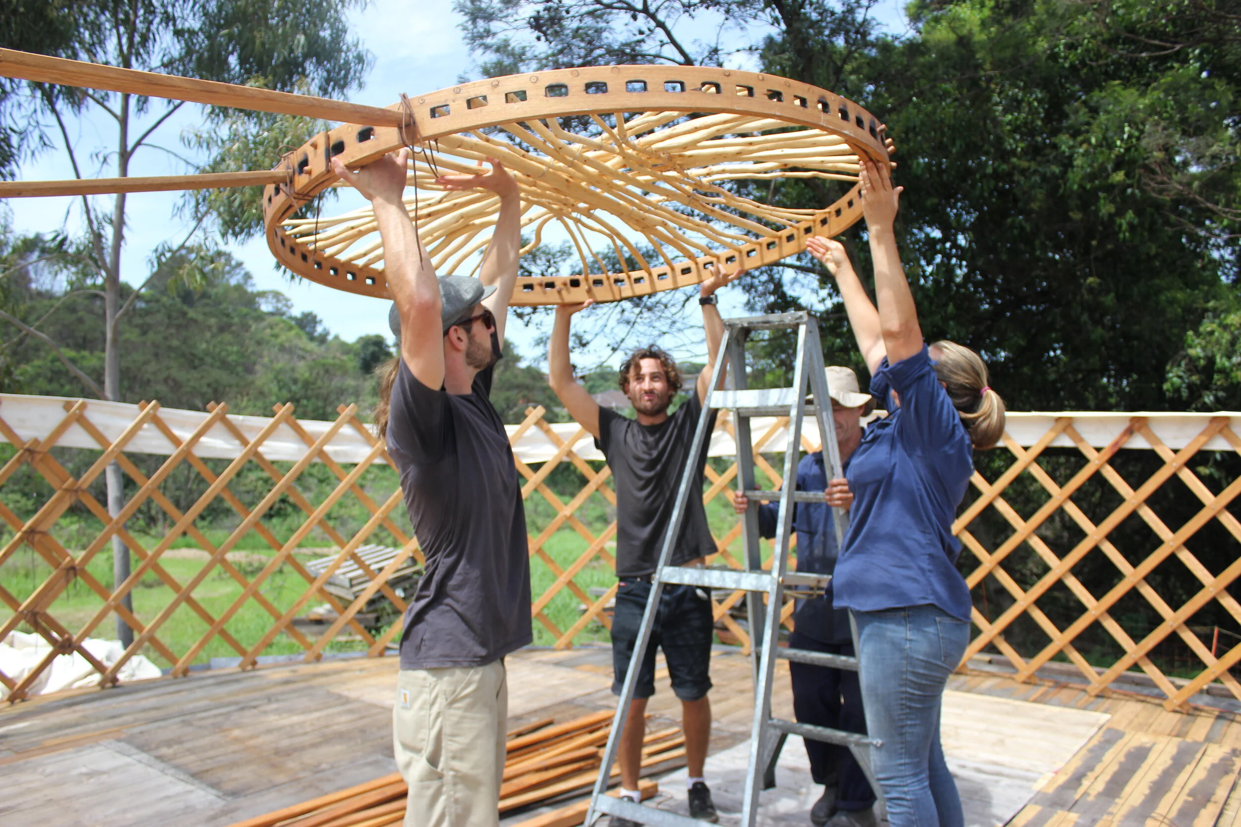 24 23 OCP Urban Grown building a Yurt frame.JPG