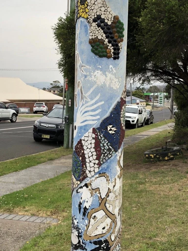 totem poles to welcome you to our community project.jpeg