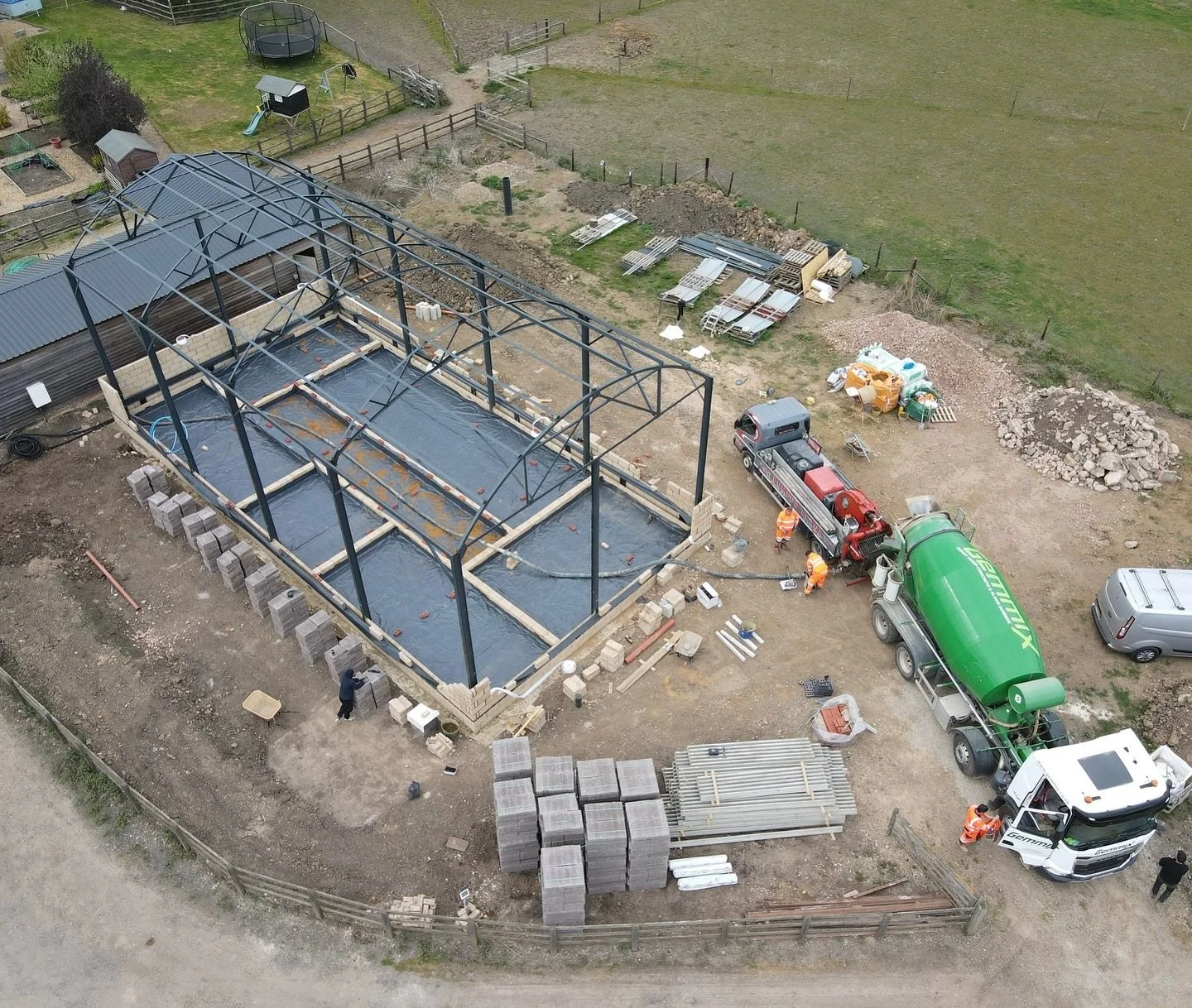 Aerial shot over our Dutch Barn project from a few weeks back. Sleeper walls set &amp; final prep before installing the block &amp; beam. More up-to-date reel to follow next 👀 
.
.
.
.
.
.
.
#barnconversion #dutchbarn #steelframe #arcitecture #block