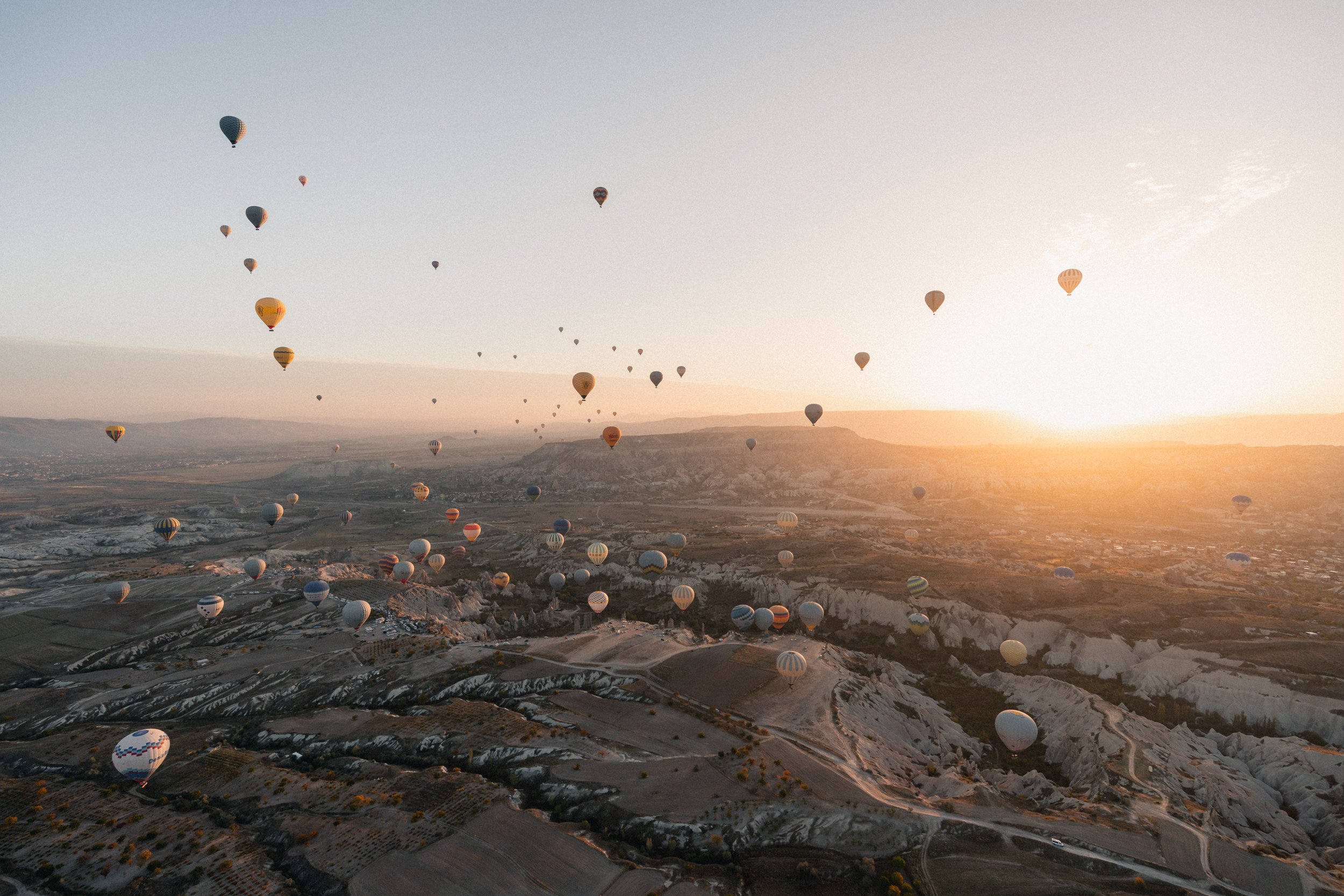 Hundreds of hot air balloons over Goreme in Cappadocia, Turkey.