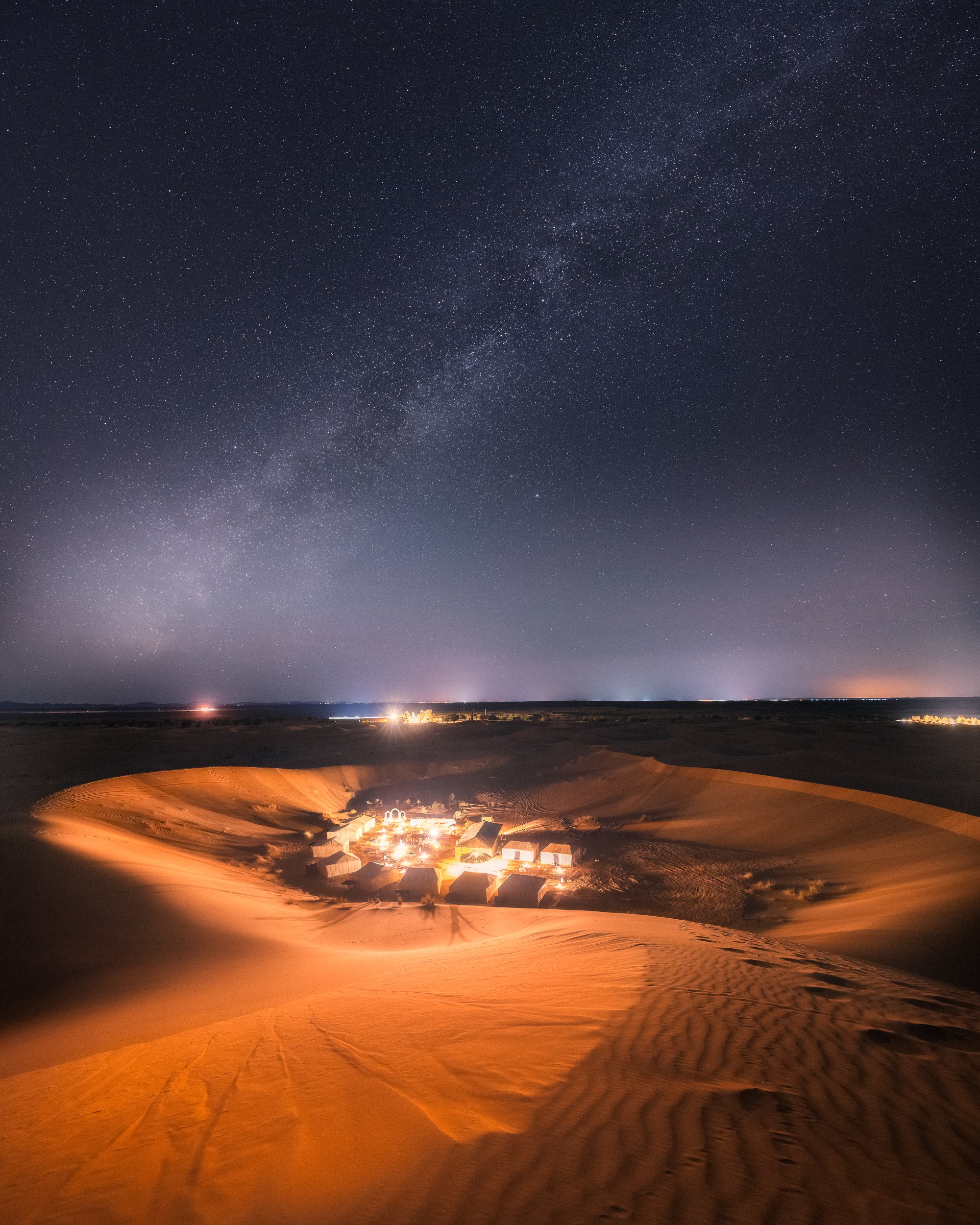 The Milky Way over a desert camp in the Sahara, Morocco.