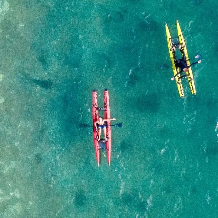 Aerial view - Kayacat Puma folding catamaran kayaks, red and yellow, on clear water | Swanage Surf & SUP.jpg