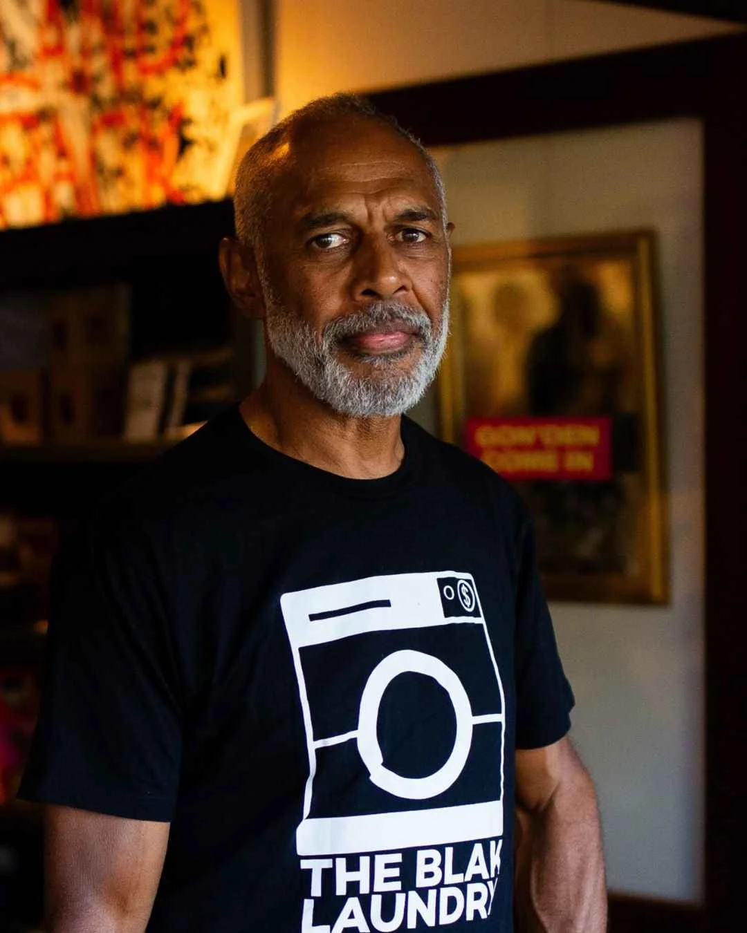 Portrait of First Nations contemporary artist Darren Blackman wearing a black T-shirt with The Blak Laundry design. LANTANA Space Artist Residency Program 2026/27.