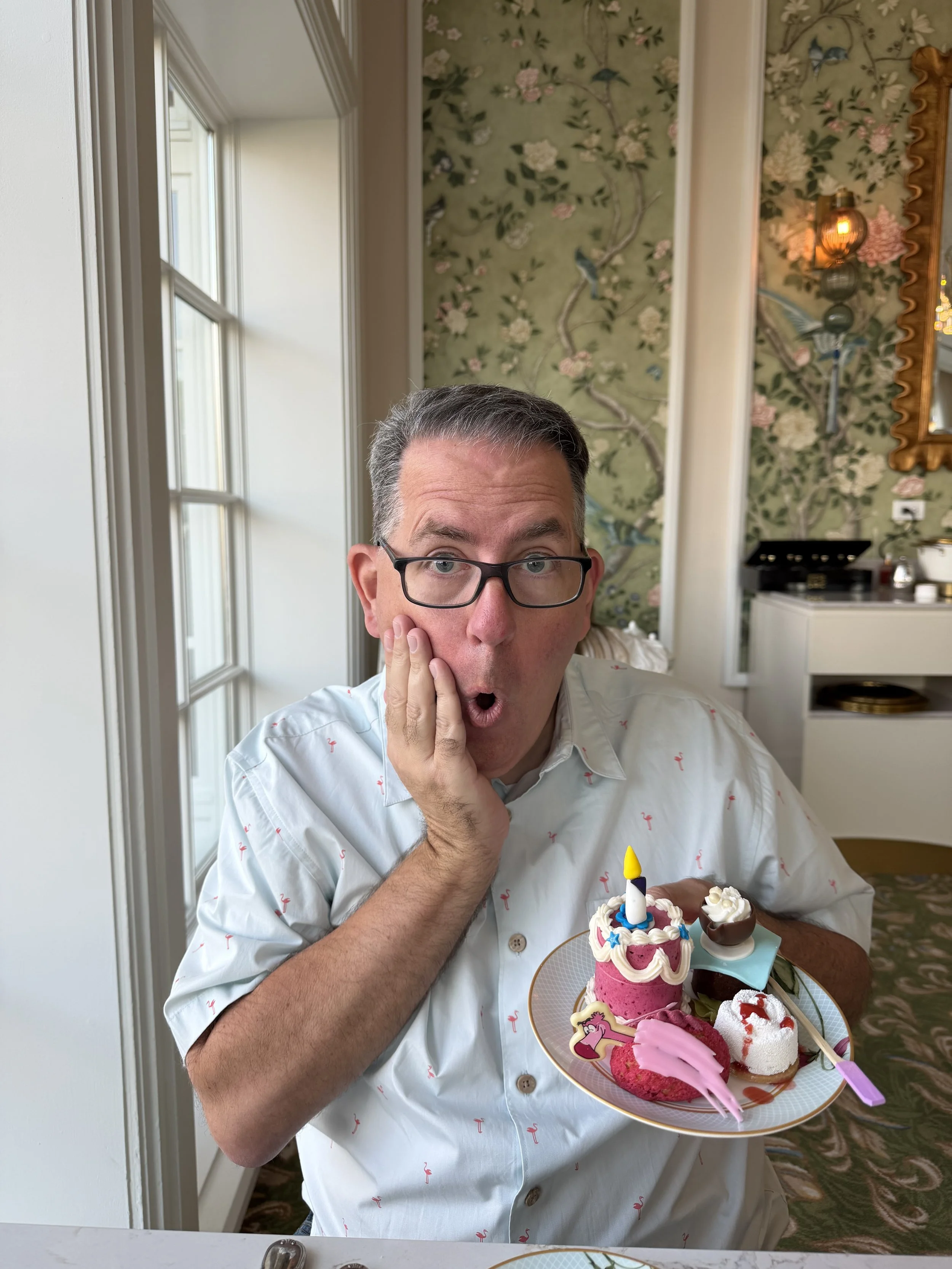 Man holding sweets from The Garden View Lounge