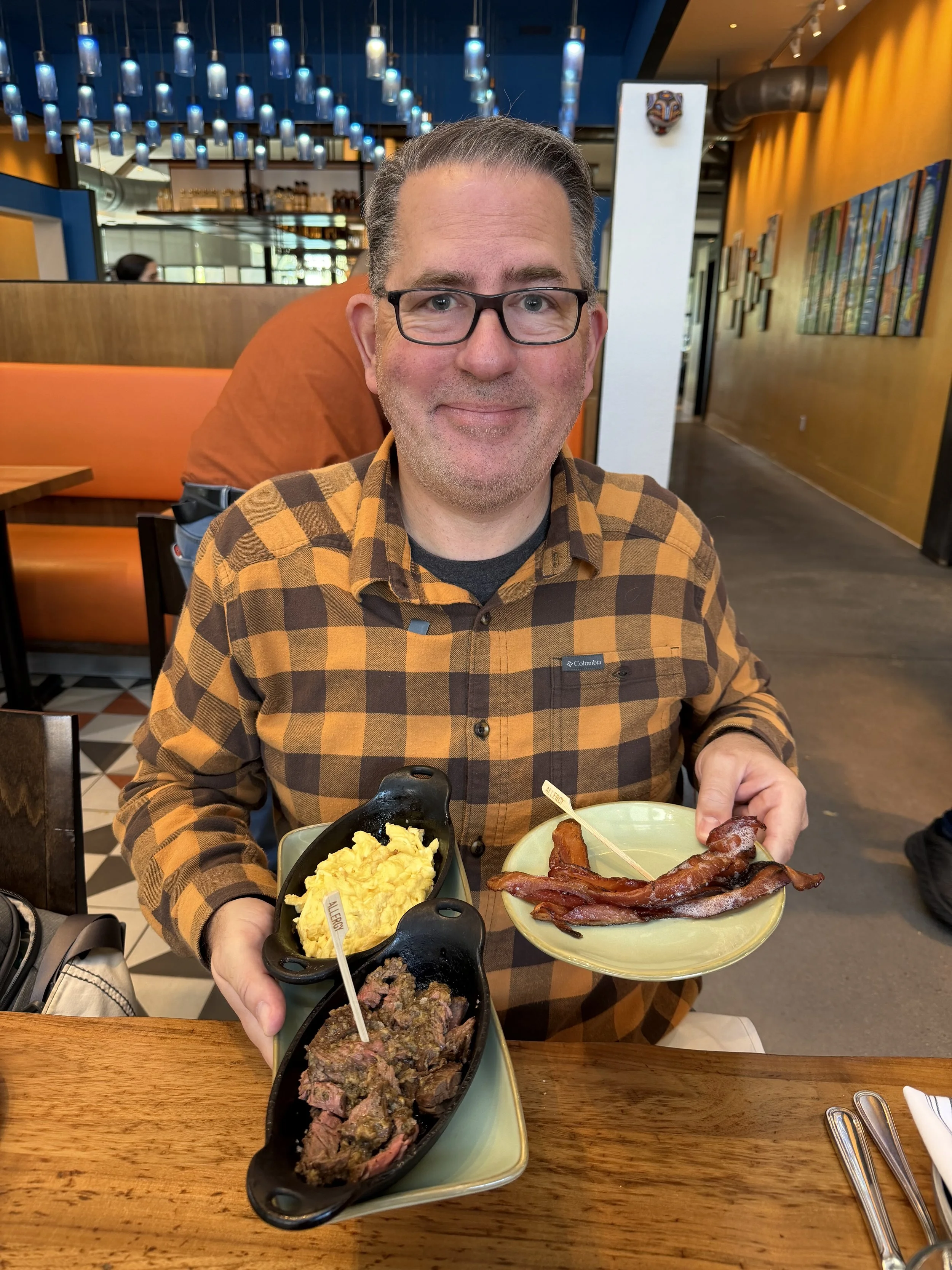 Brandon with Scrambled Eggs, Bacon & Carne Asada from Frontera Cocina