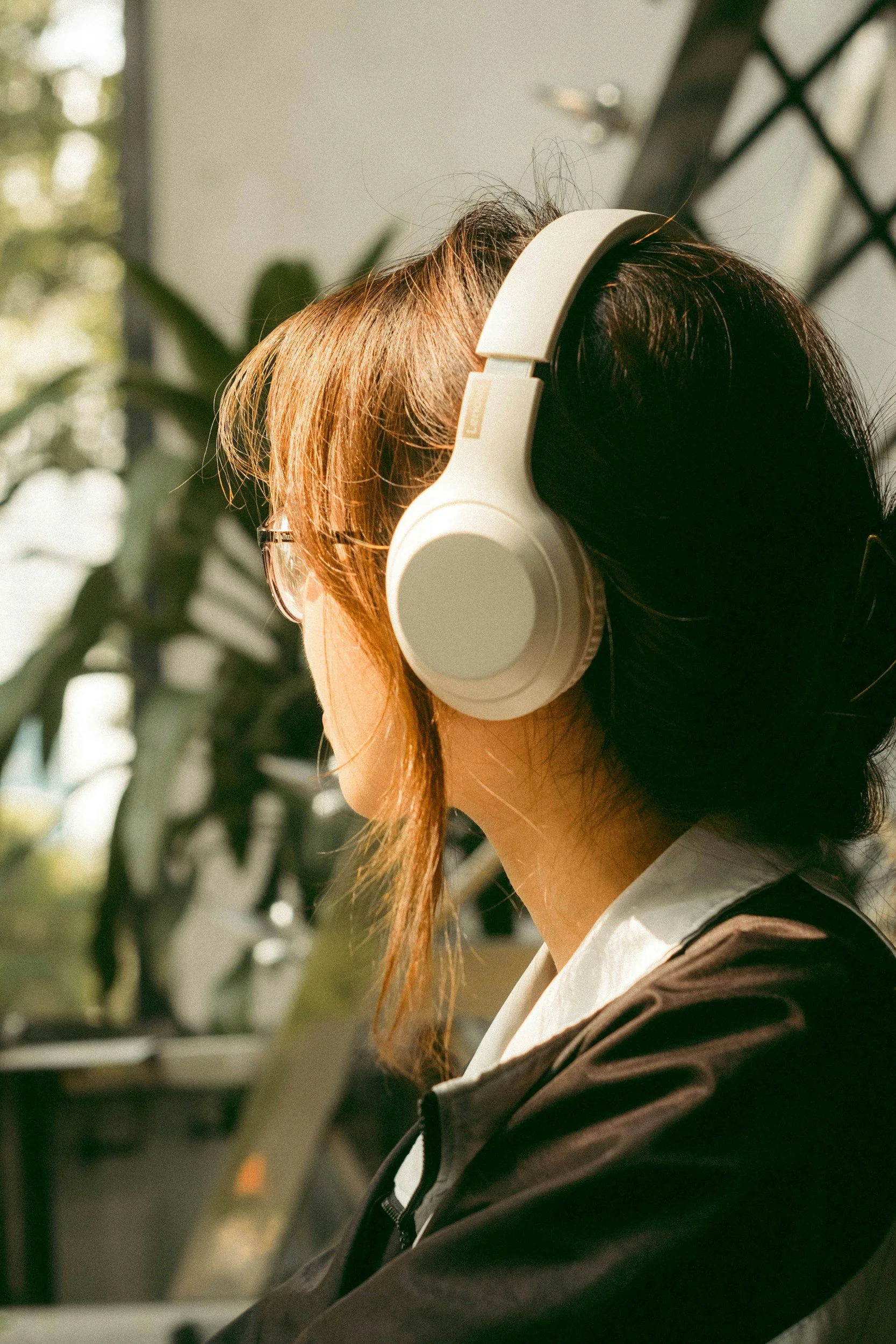 Girl with headphones listening to Safe and Sound Protocol