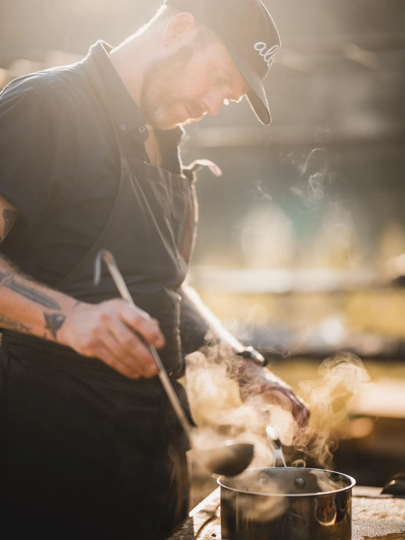 Delighted to have supplied the amazing team @weearealba with our handcrafted, waxed cotton aprons. 
Perfect for cooking over fire.
Image of Bruce, Owner / Chef at ALBA wearing his Fieldware apron 🔥
📸 @annablackwell 
#fieldware #theartofcraft #firec