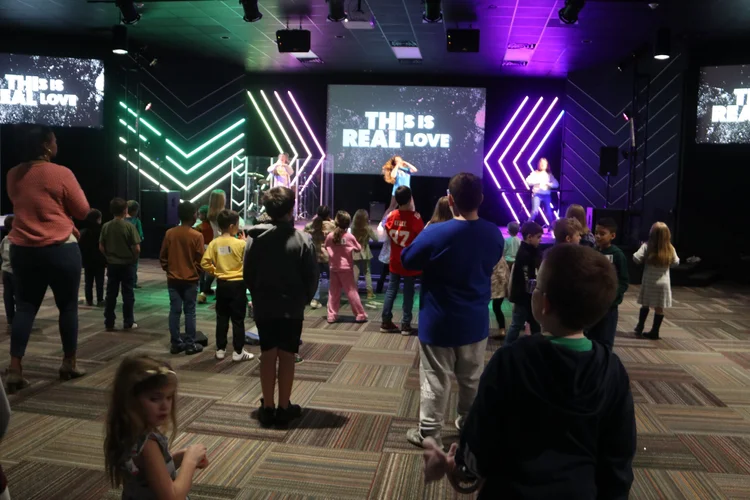 Elementary kids worshiping together in the Freedom Kids room