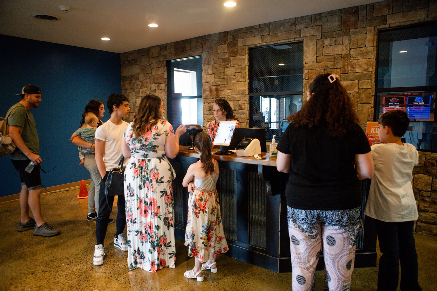 Parents checking their kids in at the Freedom Kids Welcome Desk