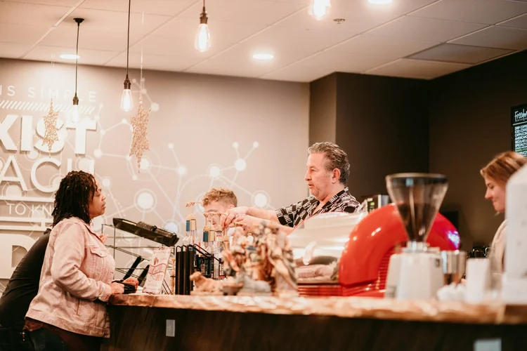 Freedom Coffee House volunteers serving coffee before church