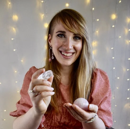 Suzie DeVoe holding healing crystals for Pranic Healing