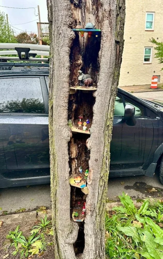 Tree with cute litte animals and figurines in on a street in Baltimore, Maryland