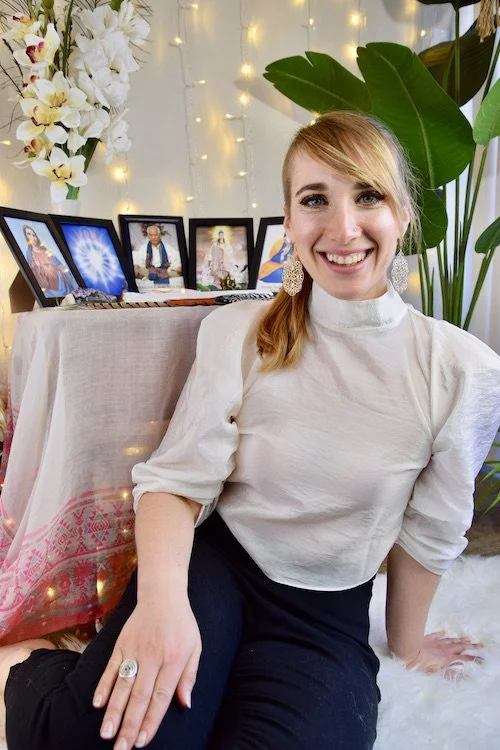 Suzie DeVoe Pranic Healer sitting in front of her altar