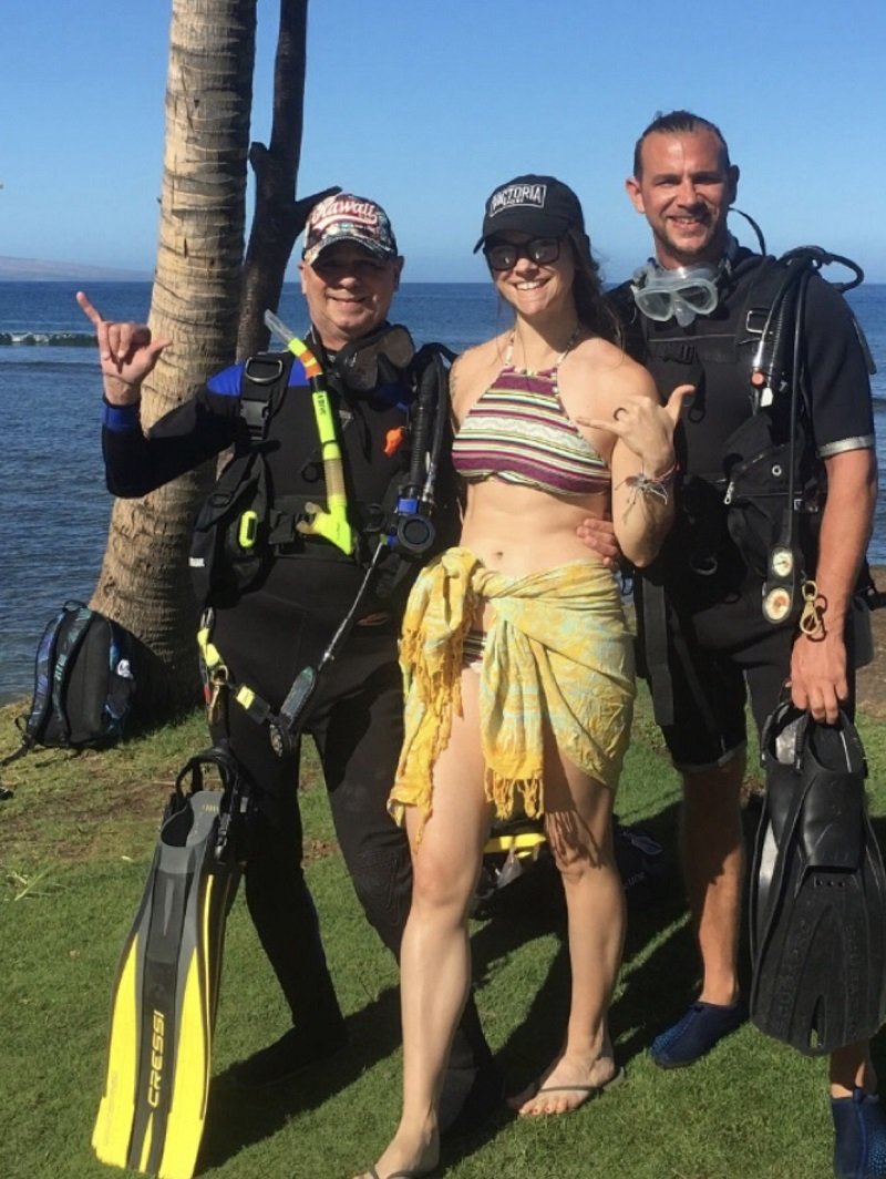 Group of three scuba divers posing for a photo before a guided scuba diving tour with Justin in San Diego at La Jolla Cove.