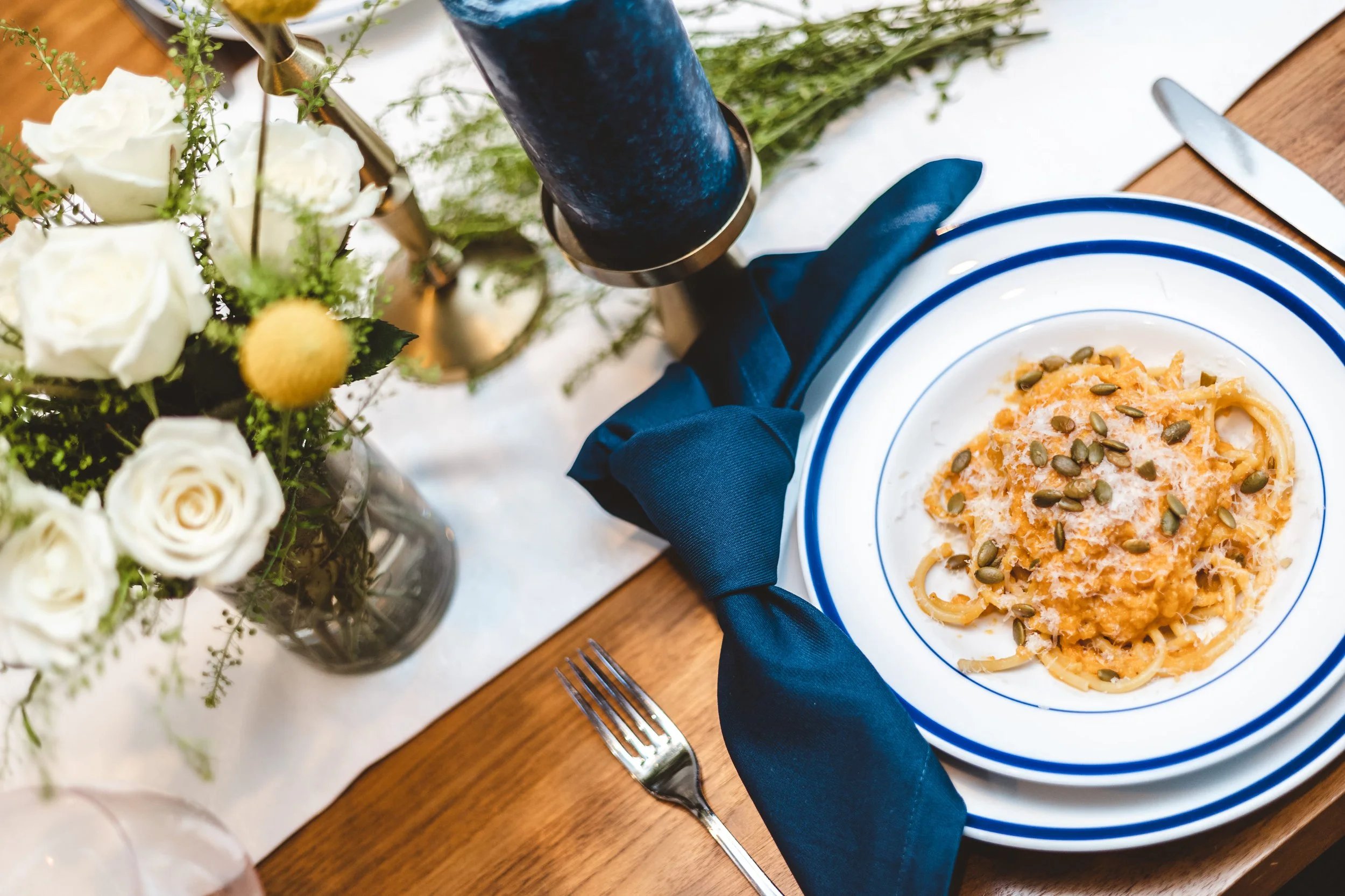 Private chef dinner party pasta course served at a luxury home table.