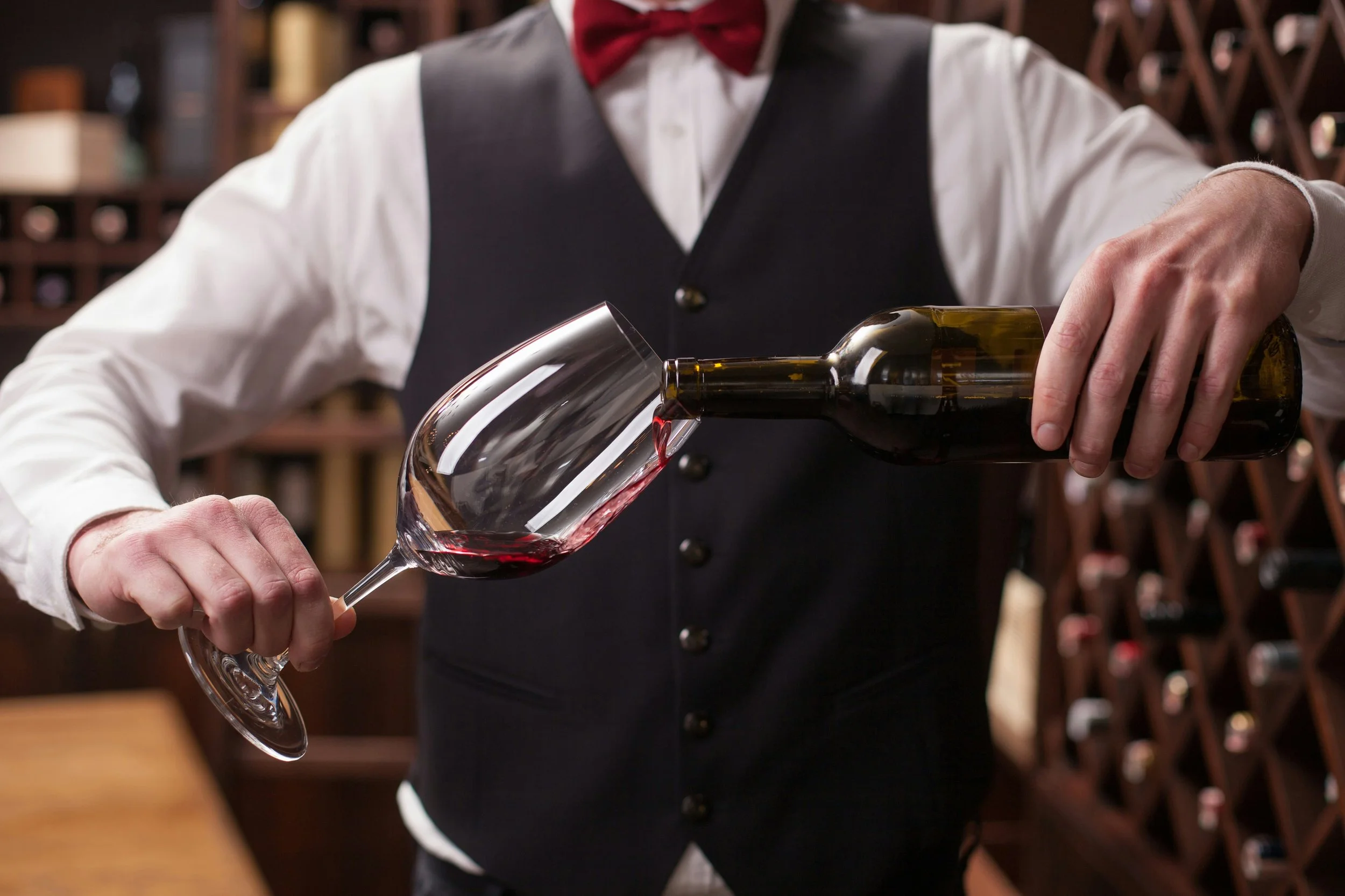 Professional Butler Serving Wine.jpg