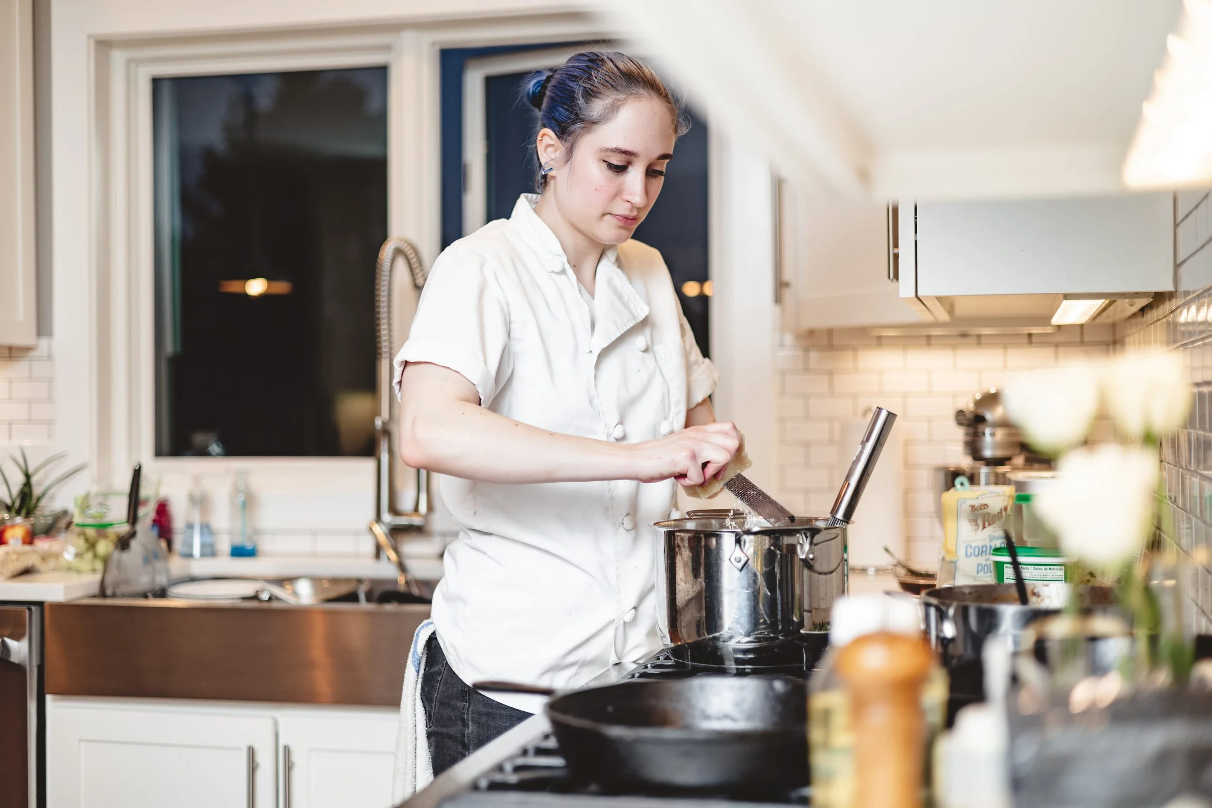 Private chef cooking in a luxury private home kitchen in Chicago.