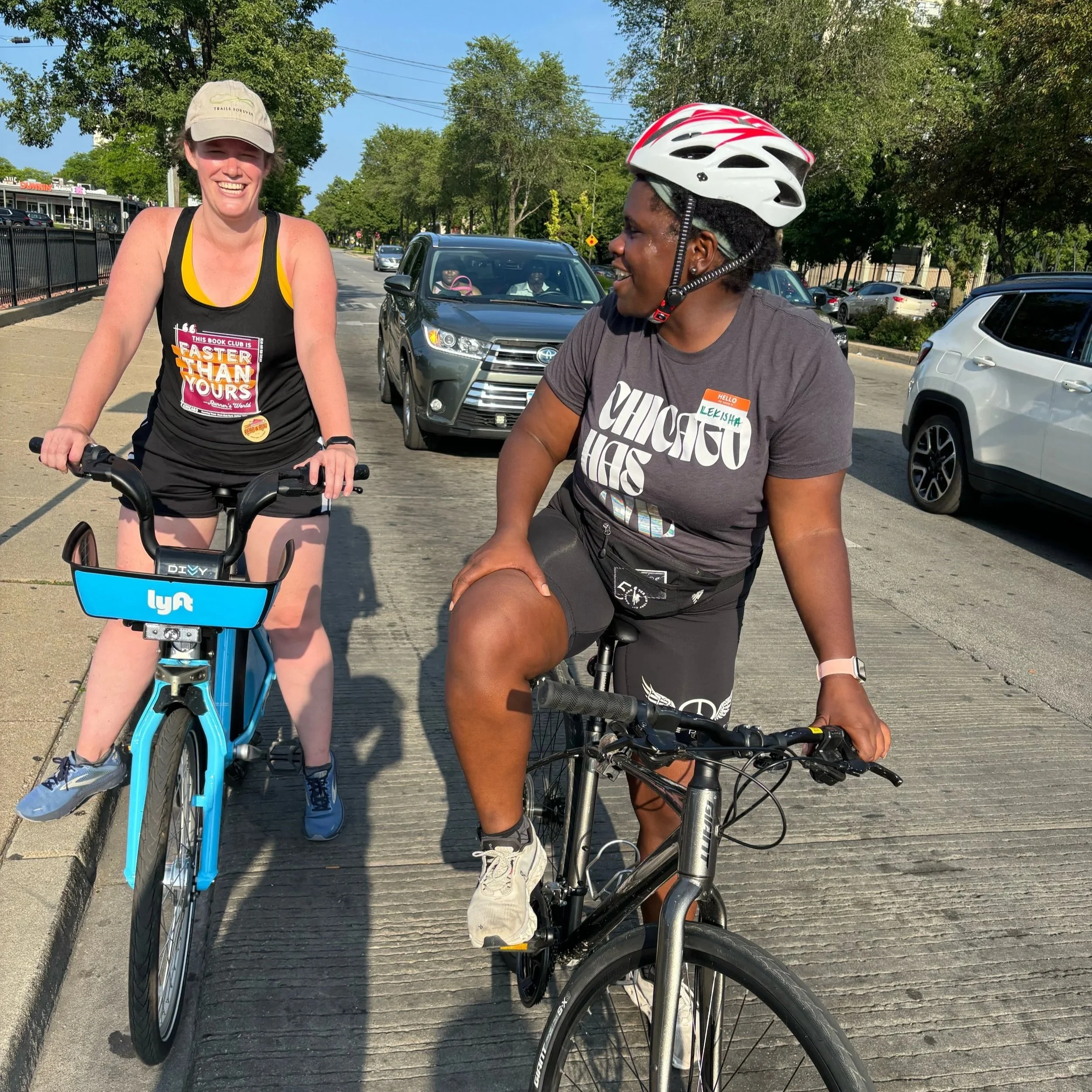 Readers & runners Rosie and Lekisha on bikes at July 2025 event in Bronzeville.
