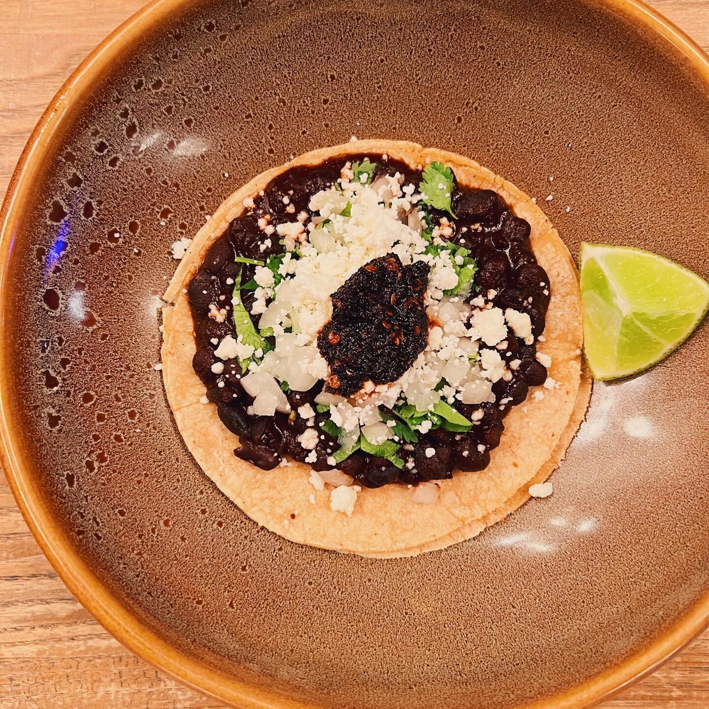 You know what day it is 💁🏽&zwj;♀️

Today&rsquo;s veggie special is::
🌮 Frijoles de rancho // guajillo stewed black beans, queso fresco, cilantro + onion, salsa macha 

🌮 $3 along with the usual suspects::
🌮 Chicken TINGA 
🌮 Cochinita PIBIL 

#t