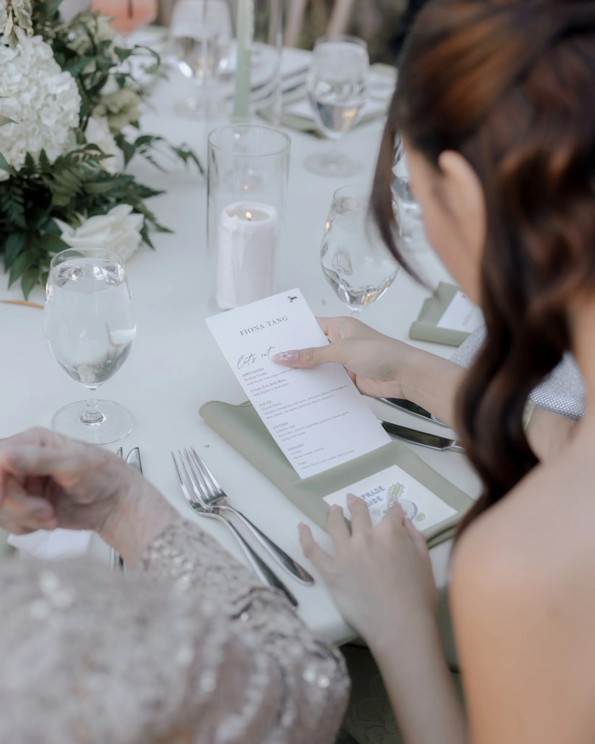 Sharon + Dylan&rsquo;s reception design details:

From the custom menus and stationery to the alternating candlelit tablescapes&mdash;ones featuring lush floral centerpieces and the others styled with delicate bud vases&mdash;every element was though