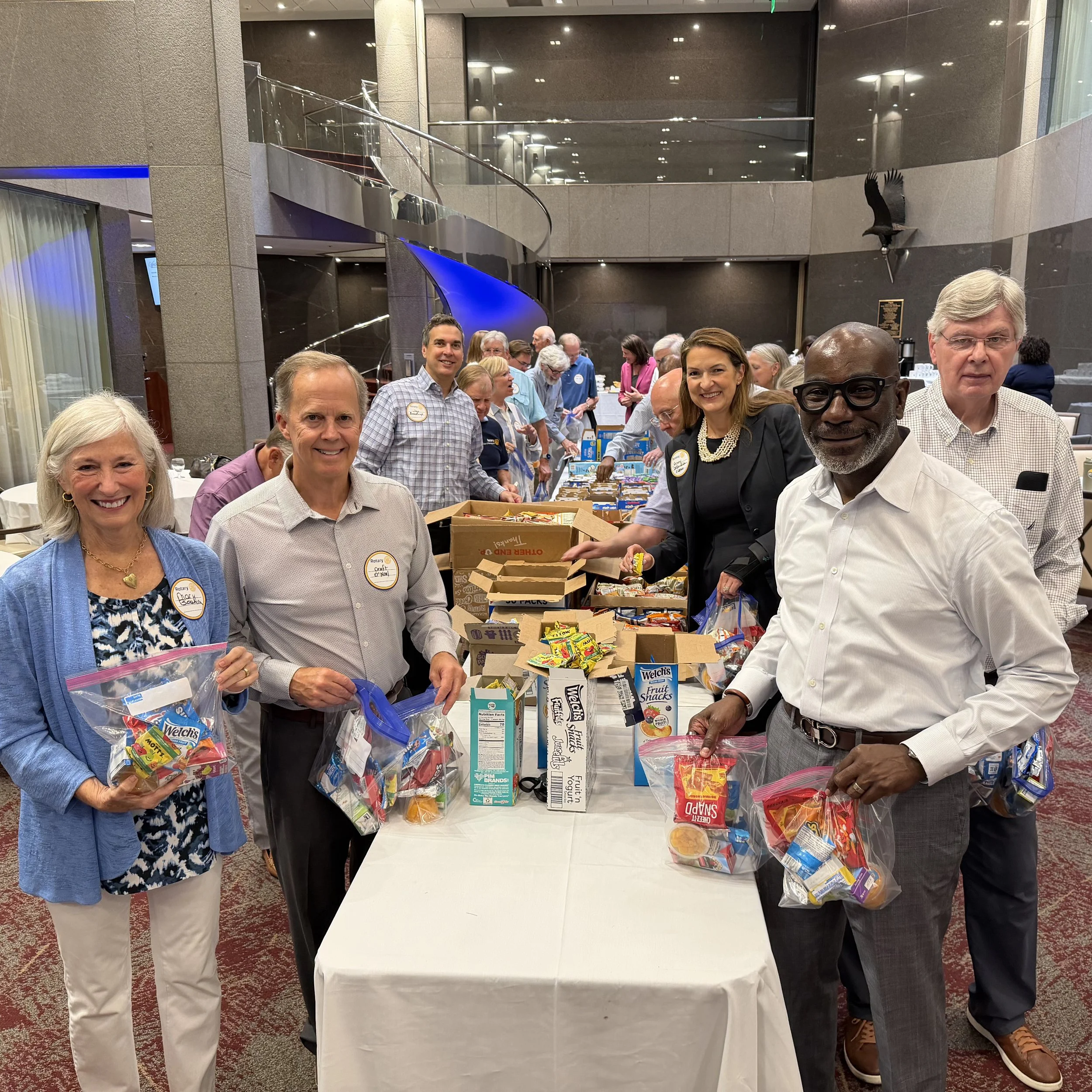 Rotarians Pack Snack Kits for Birmingham City Schools PreK Students