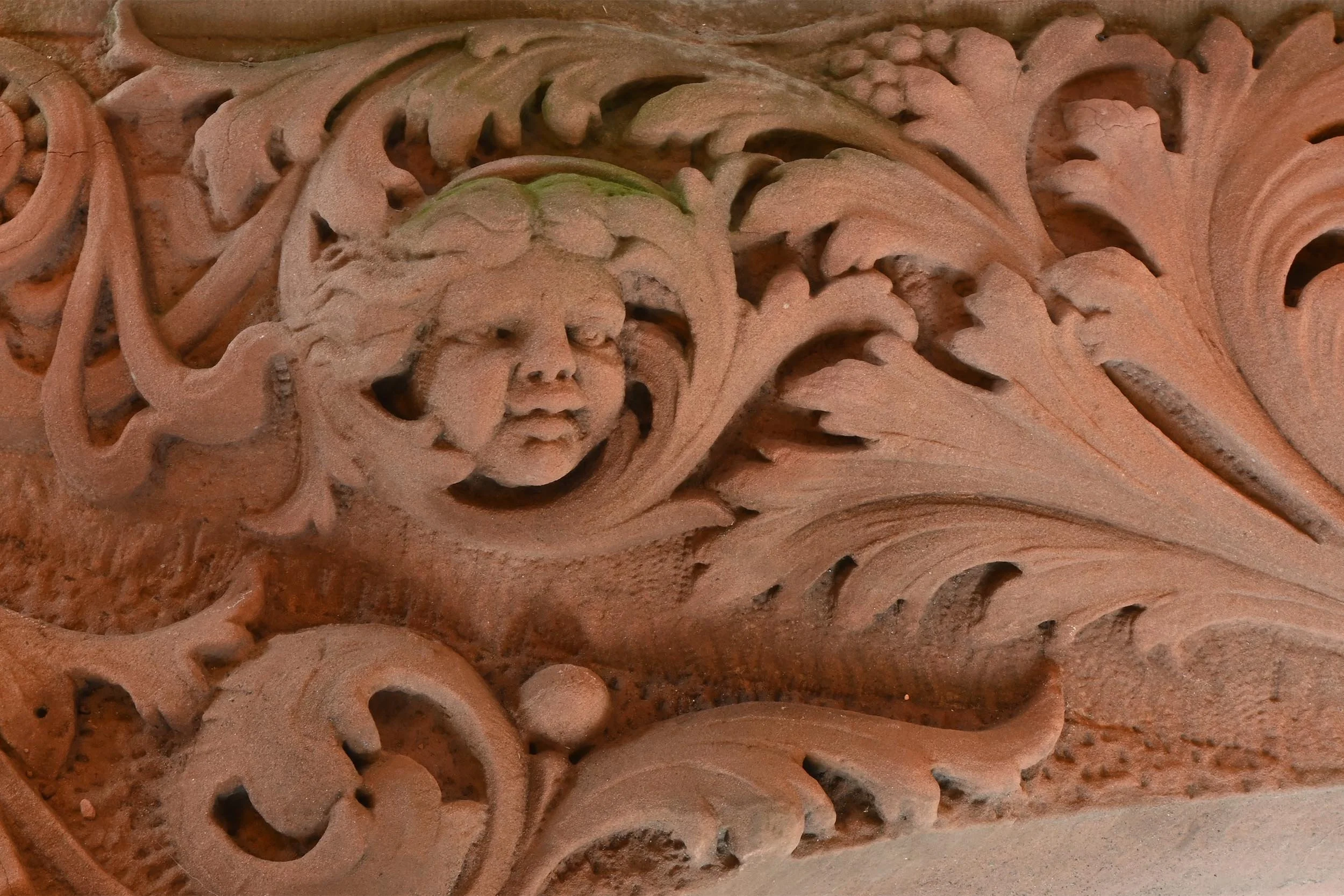 three face hided in acanthus brownstone archway left.jpg