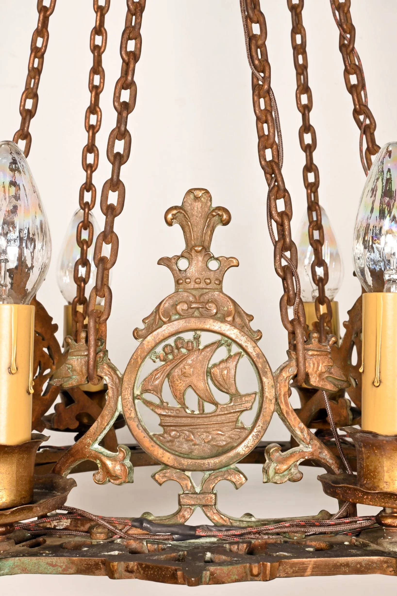 63110+bronze+six+candle+chandelier+with+ship+and+serpent+emblem+2.jpg