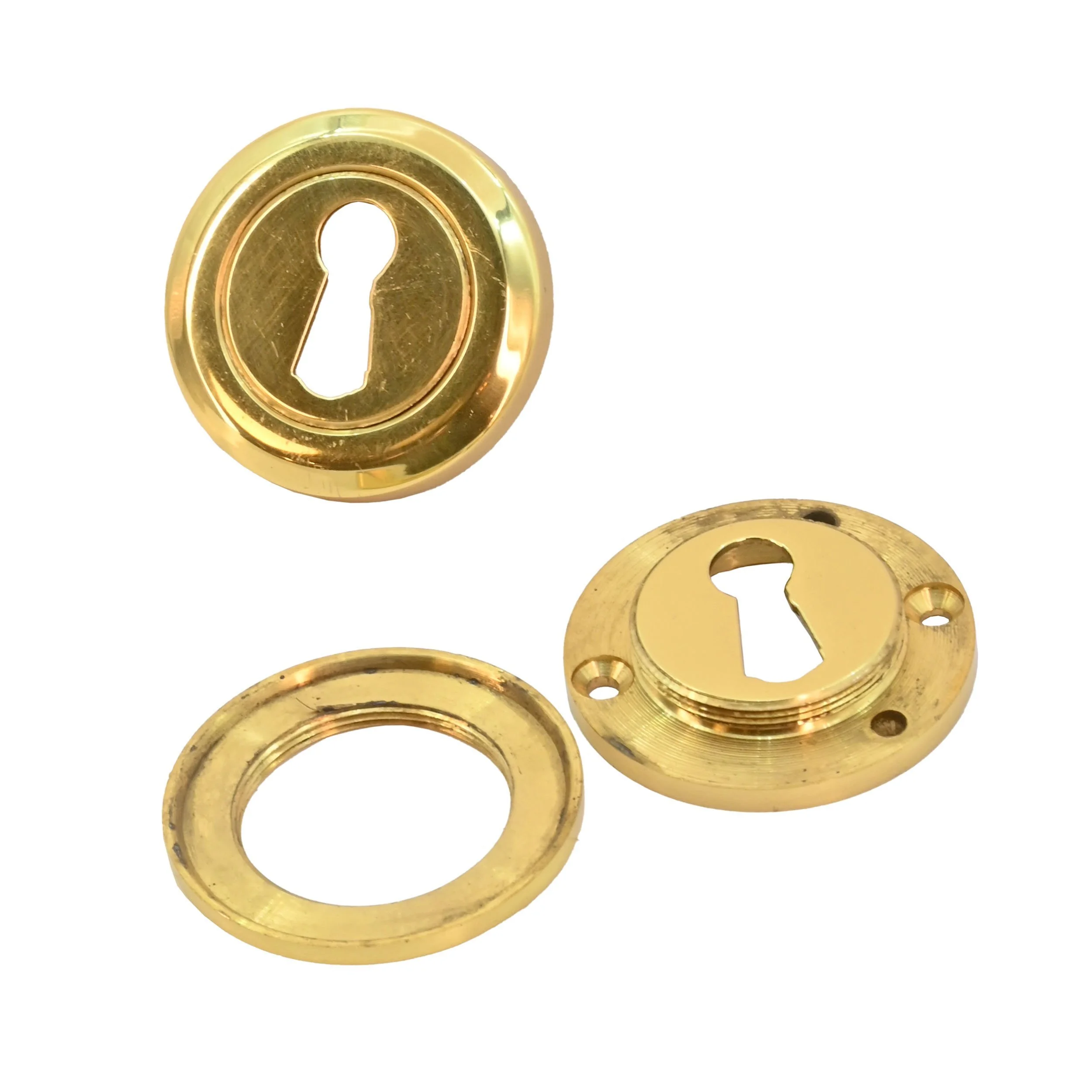 24227+brass+new+old+stock+keyhole+covers+1.jpg