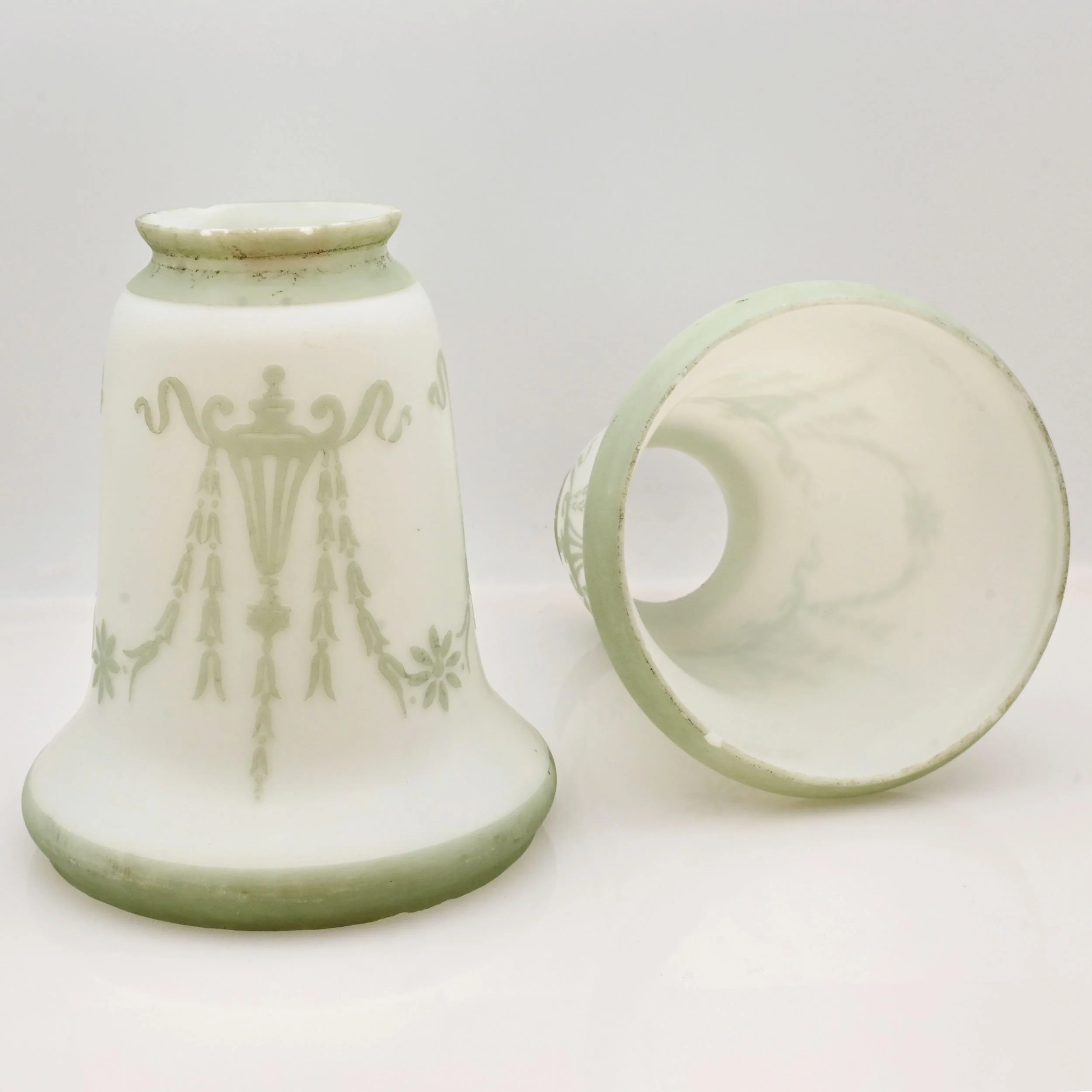 26137+pair+of+unsigned+steuben+white+calcite+glass+shades+with+raised+green+urn+pattern+2.jpg