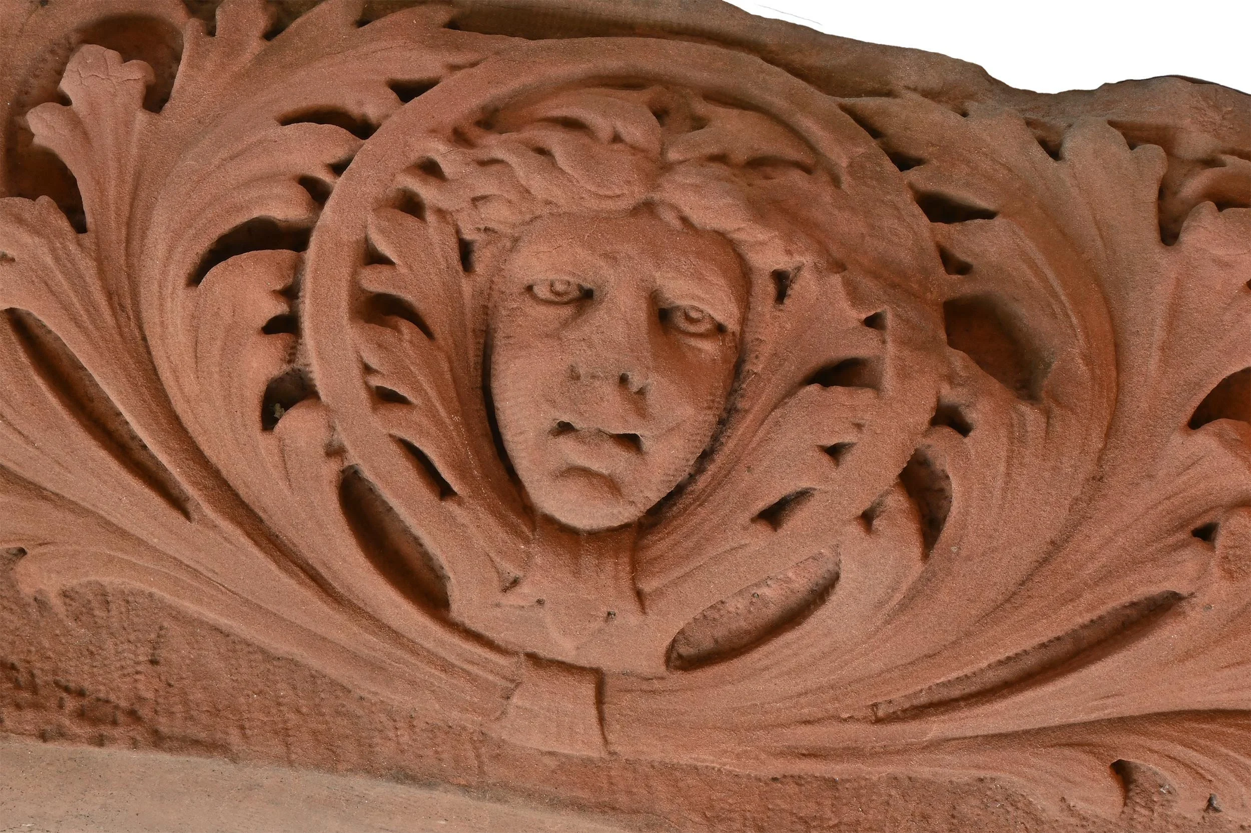 three face hided in acanthus brownstone archway center.jpg