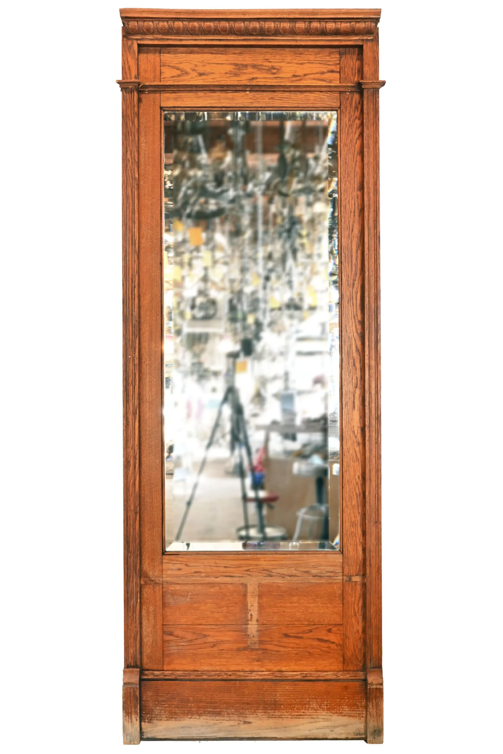 beveled mirror in floor to ceiling oak drugstore frame