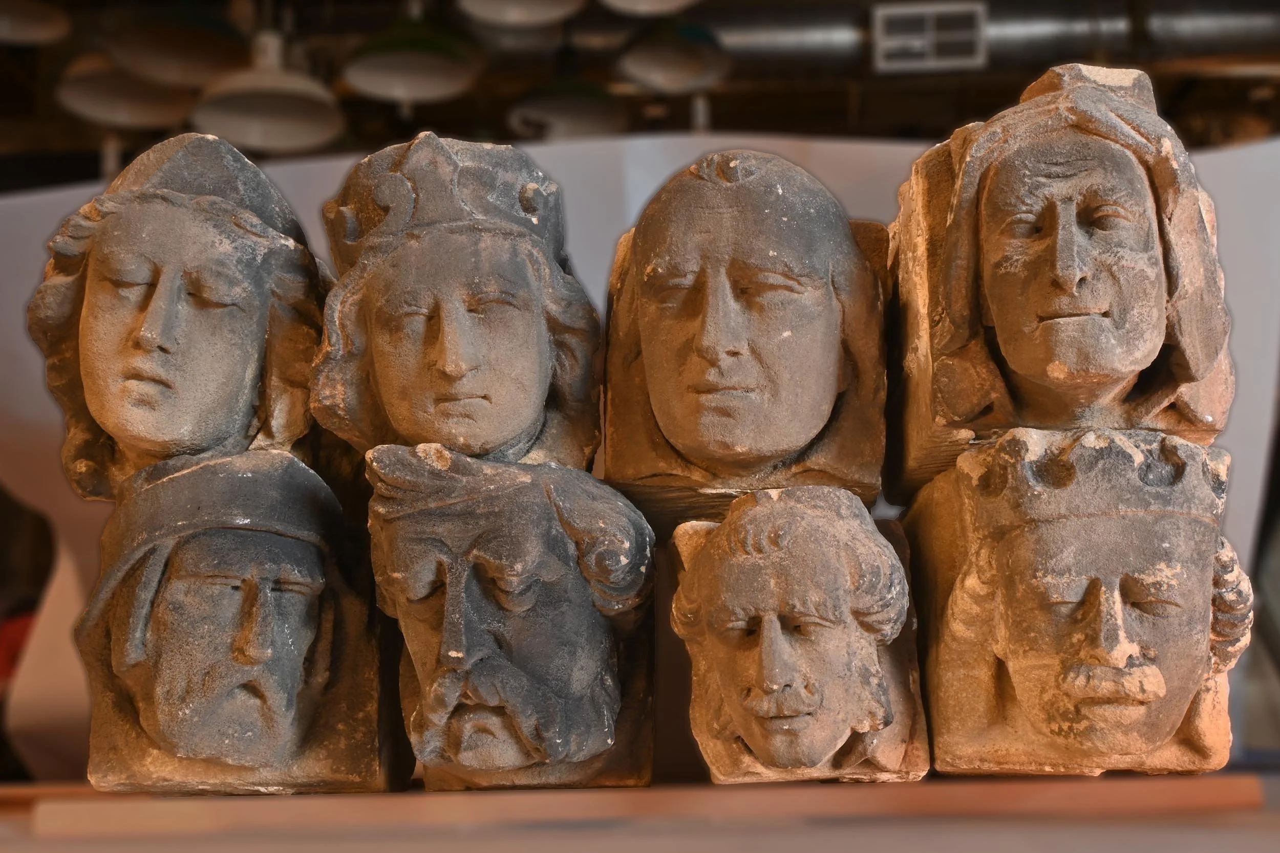 27423 eight carved stone heads.jpg
