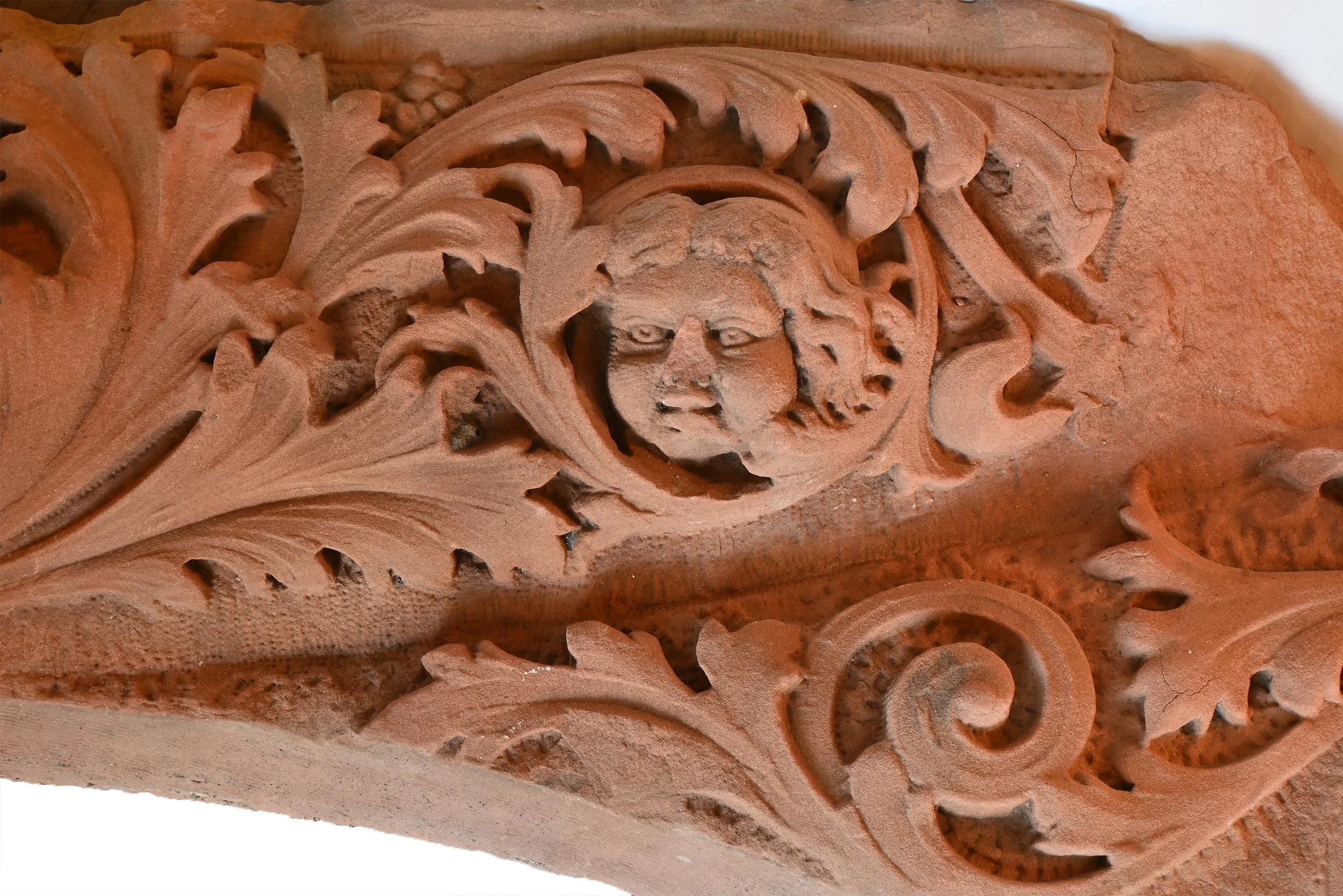 three face hided in acanthus brownstone archway right.jpg