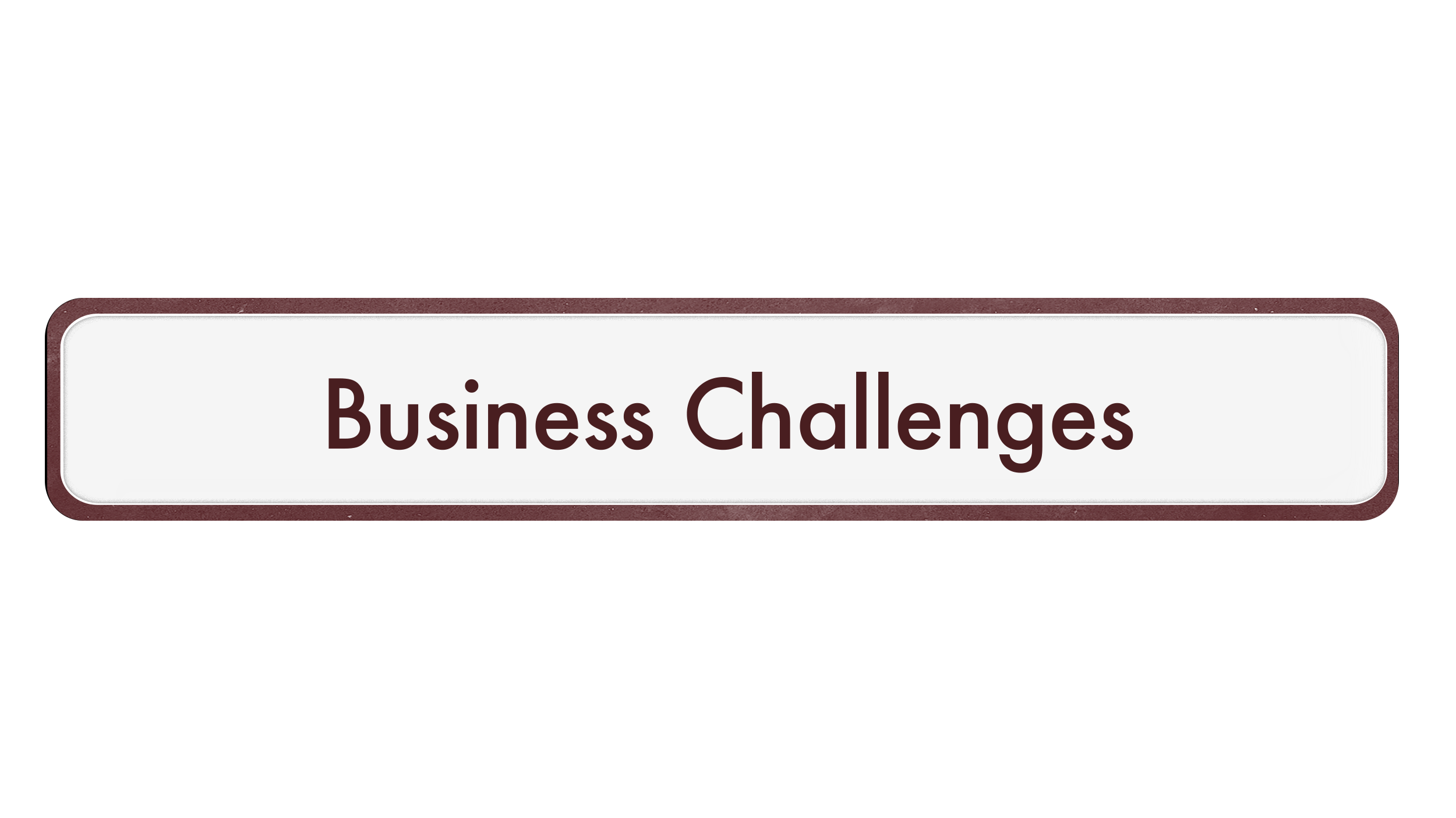 Close-up of a black and red rectangular label with rounded corners, reading 'Business Challenges' in dark red text.