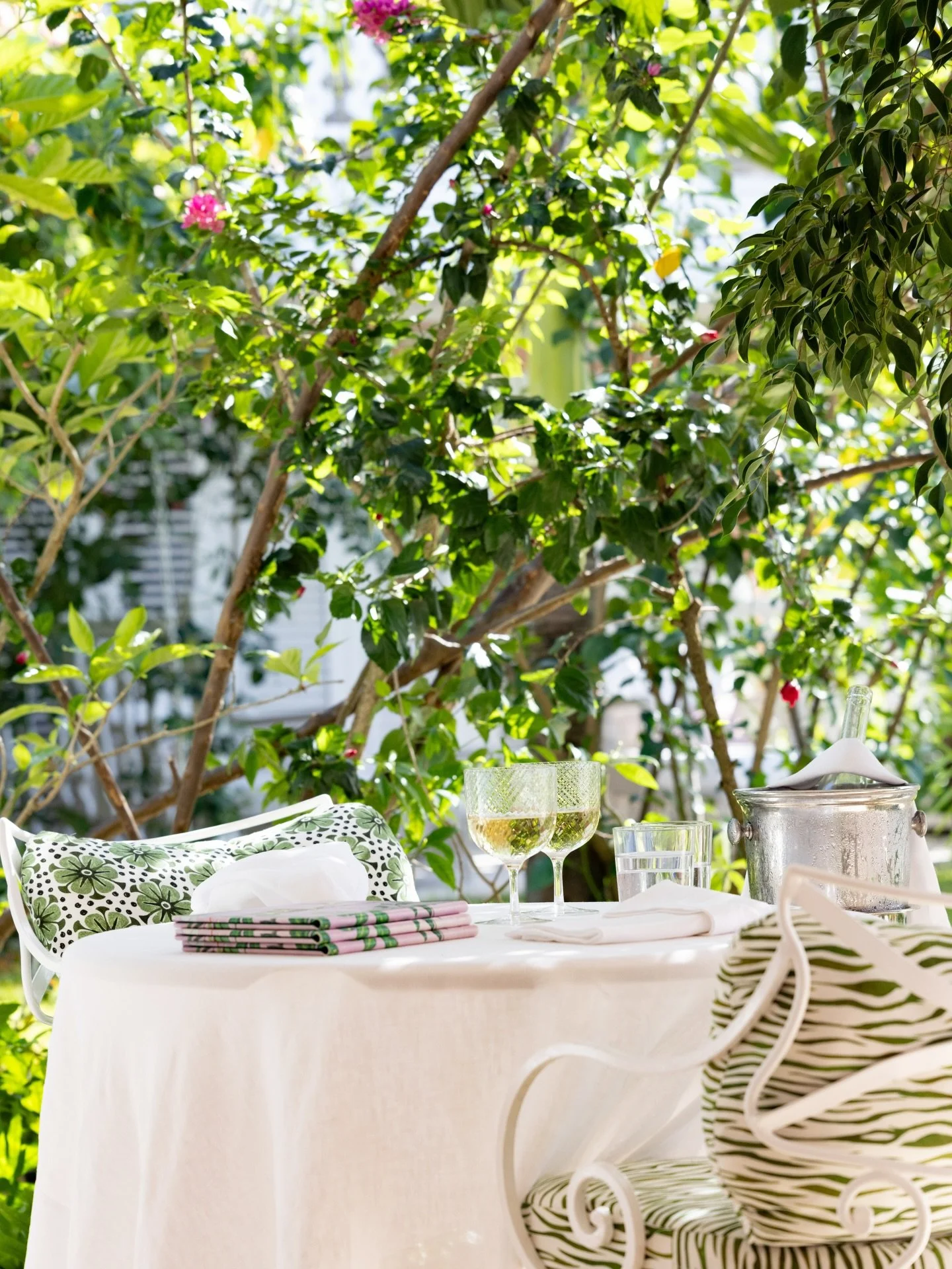 Join us for lunch? Surrounded by greenery but with views out to sea, this is one of our most charming spots.