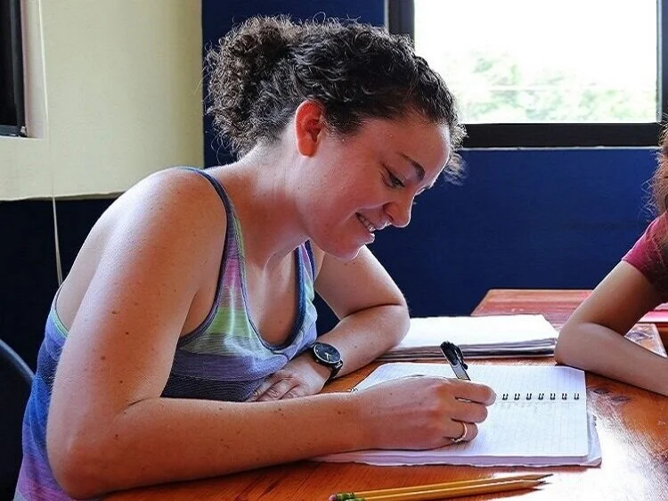 A+Spanish+Immersion+student+enjoying+the+Na%27atik+solar-powered+AC%2C+sunny%2C+modern+classroom+for+her+classes