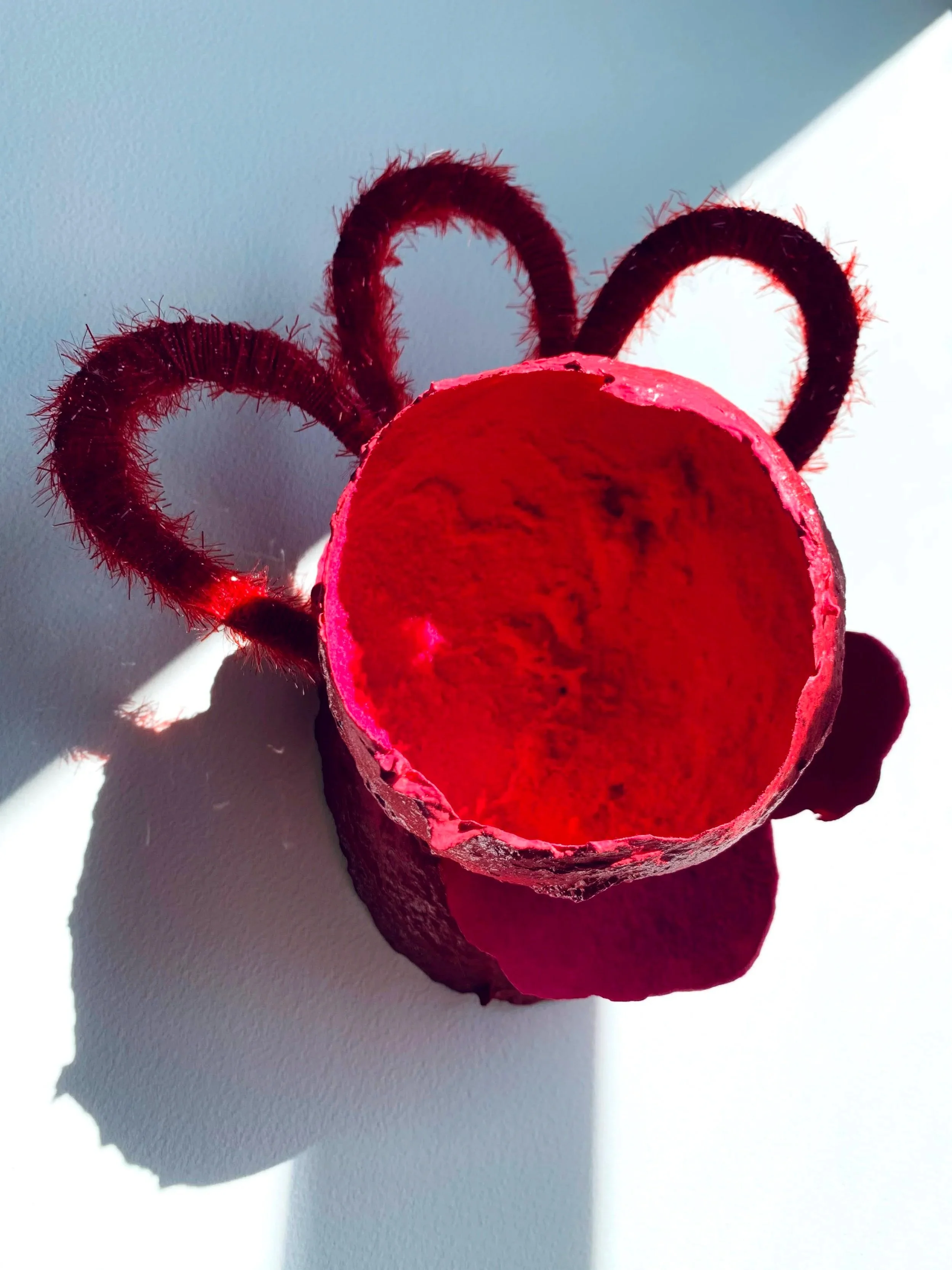 toilet paper, white glue, joint compound, cardboard, yarn, spray paint, flocking powder