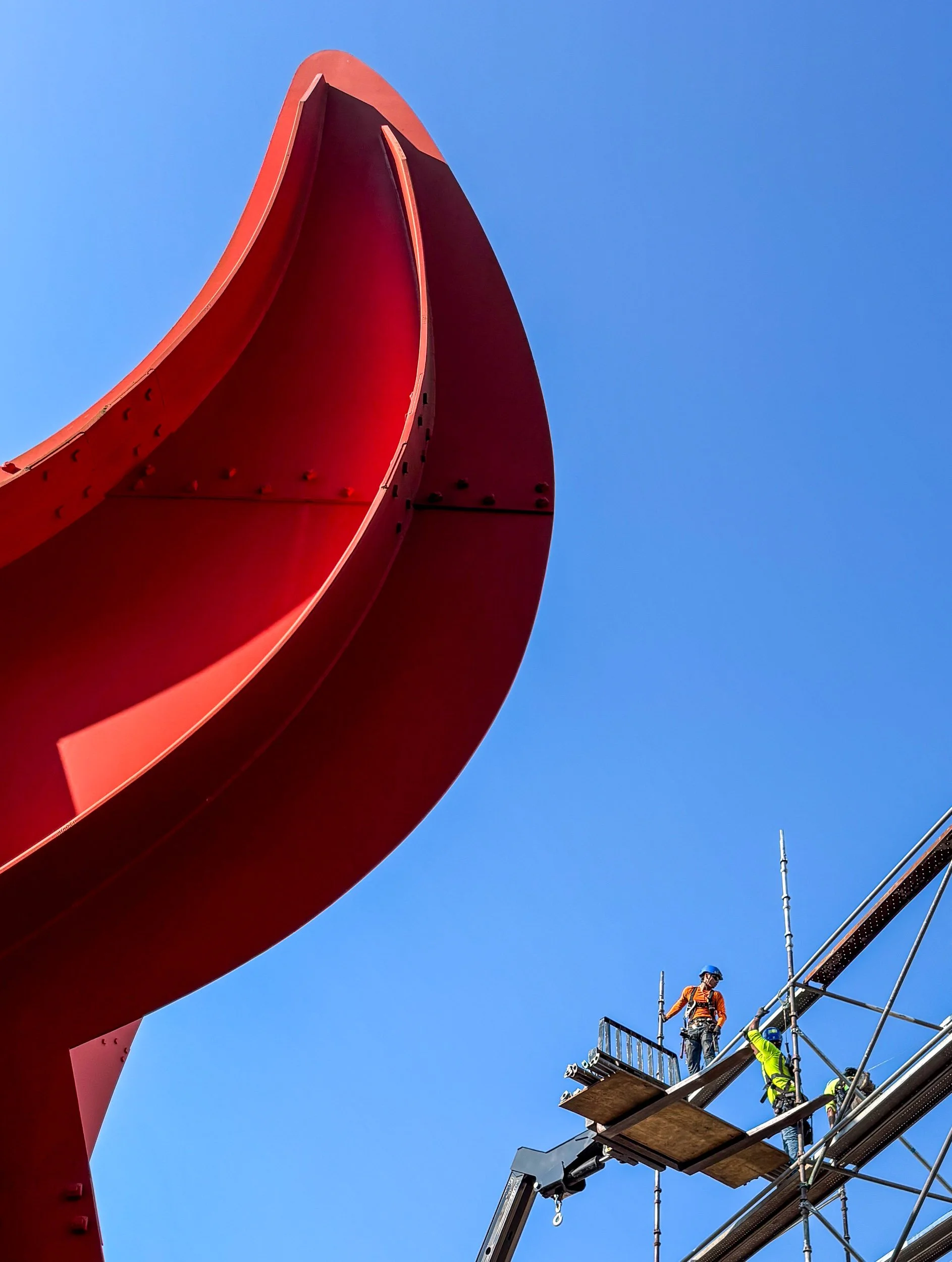 Erecting scaffolding for blast media and paint containment structure