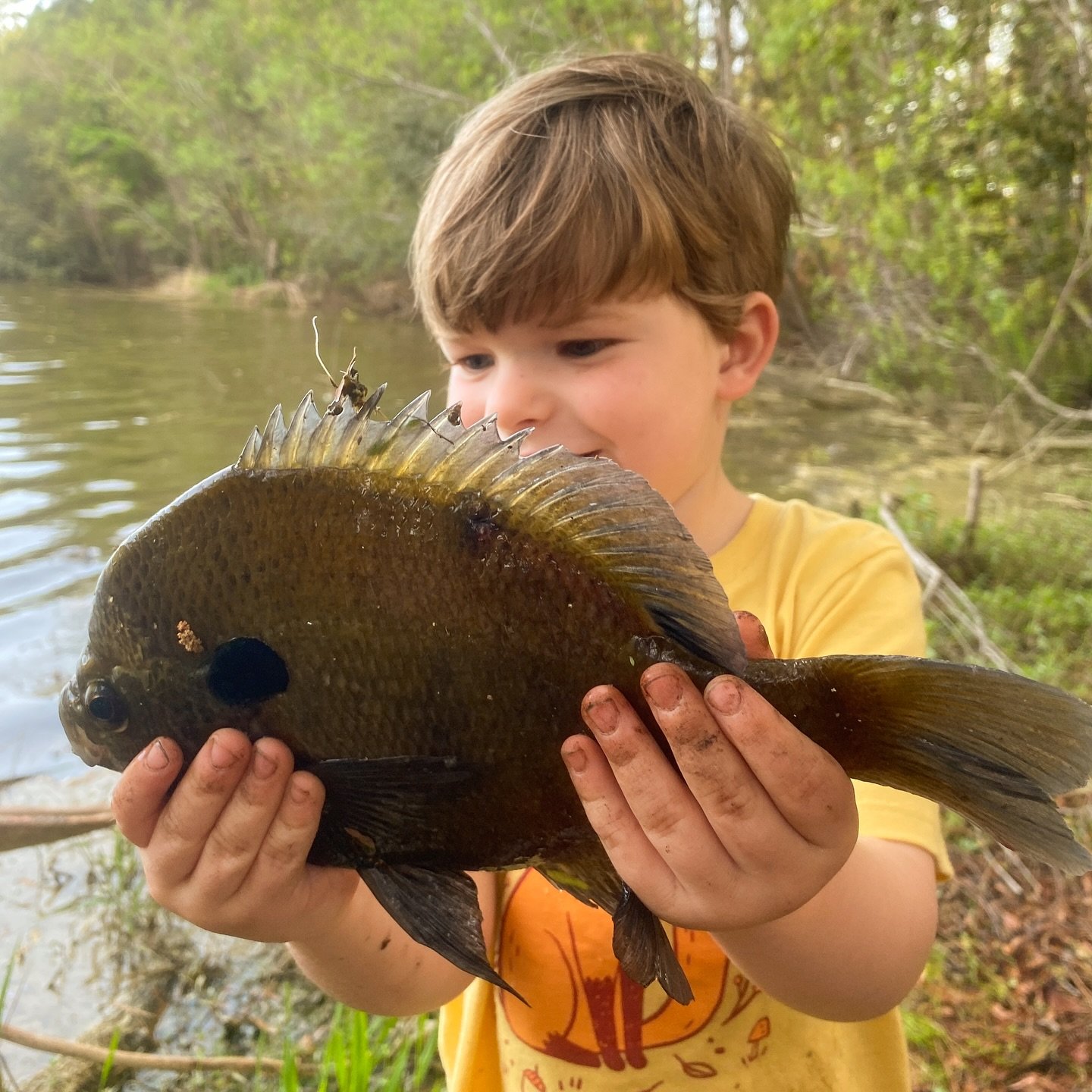 Little man found a worm in the yard and wanted to catch a fish with it.
